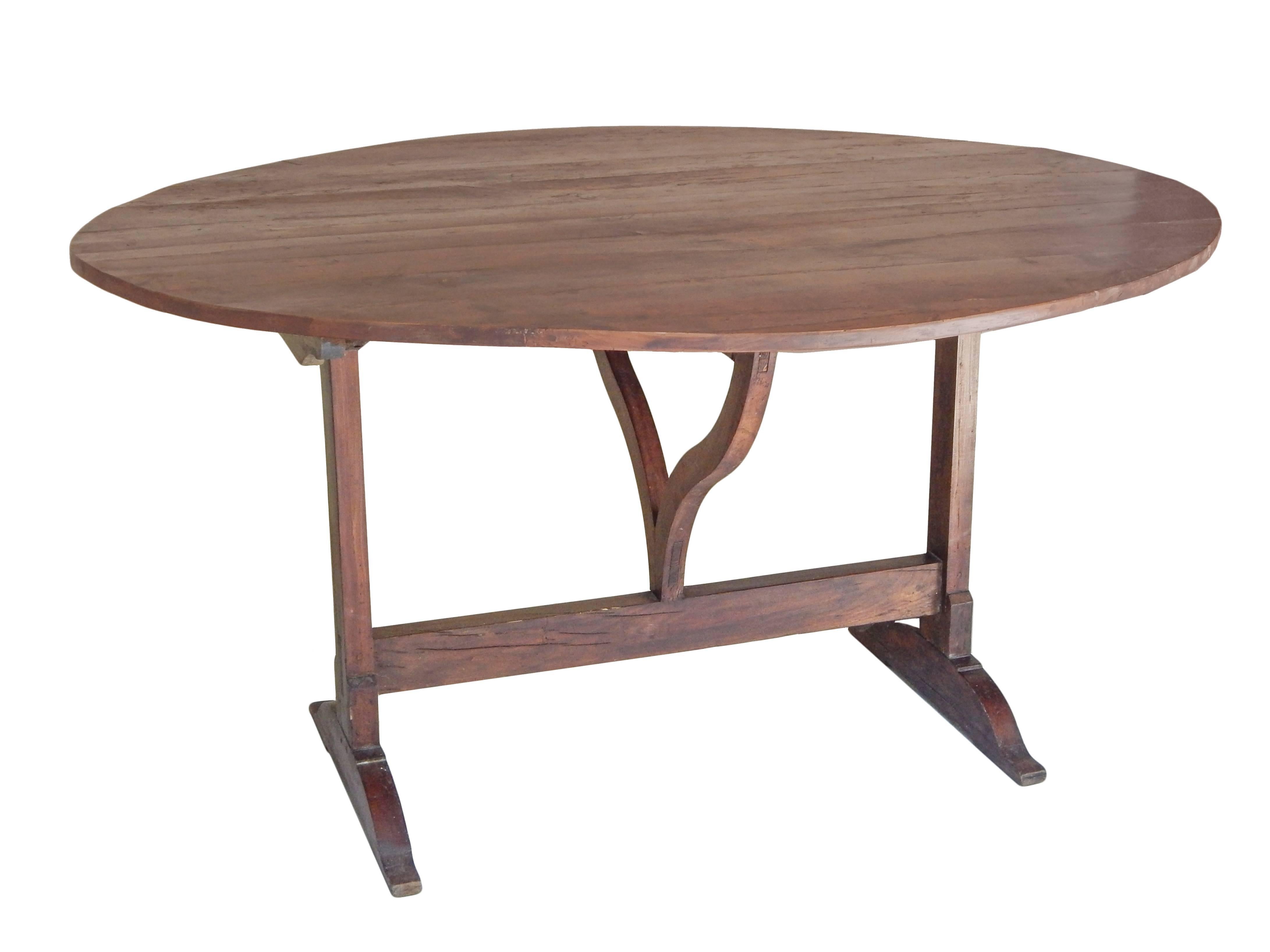 Very fine oval French wine tasting table with beautiful age patina.