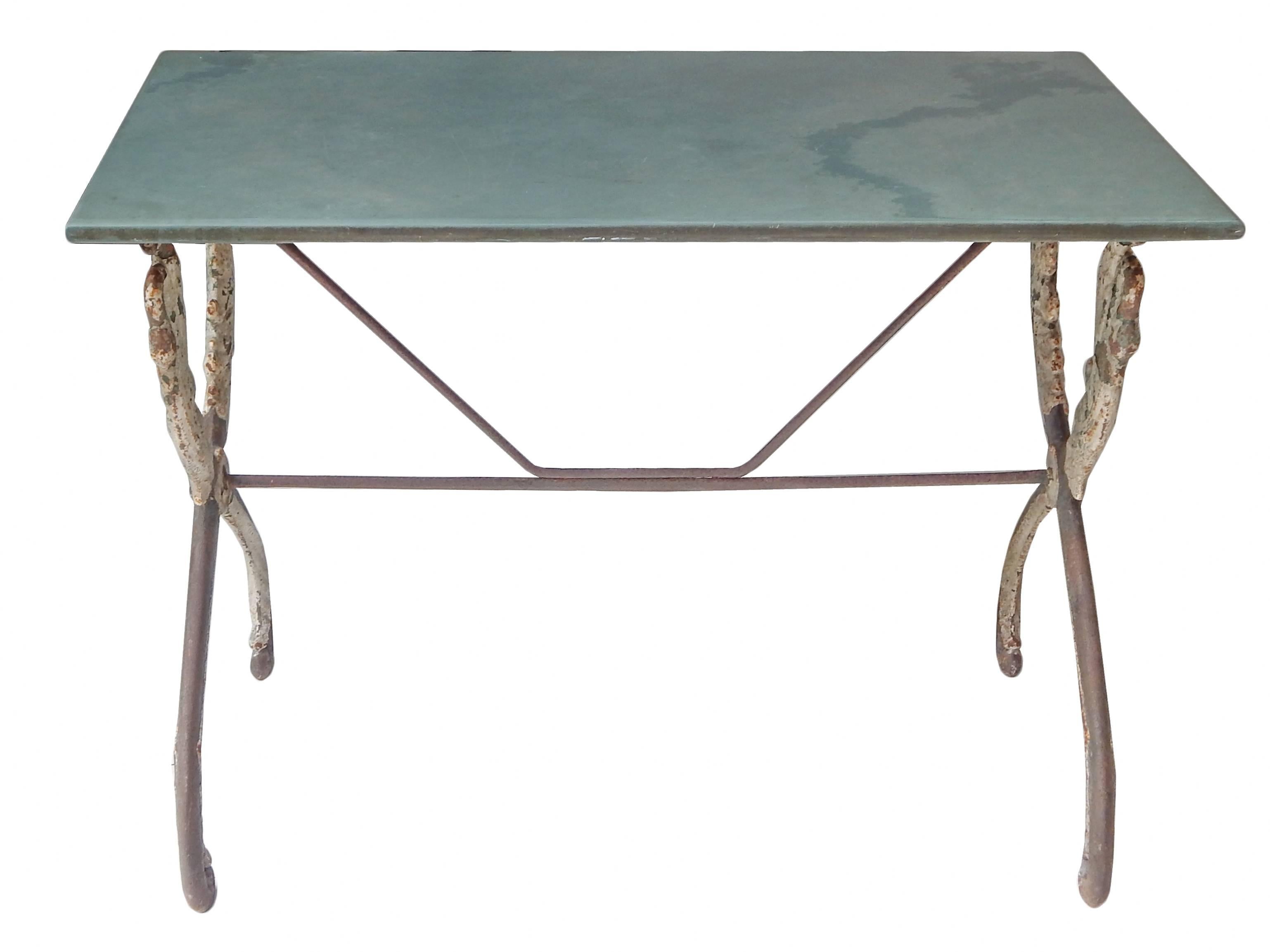 French iron swan table with honed slate top.
