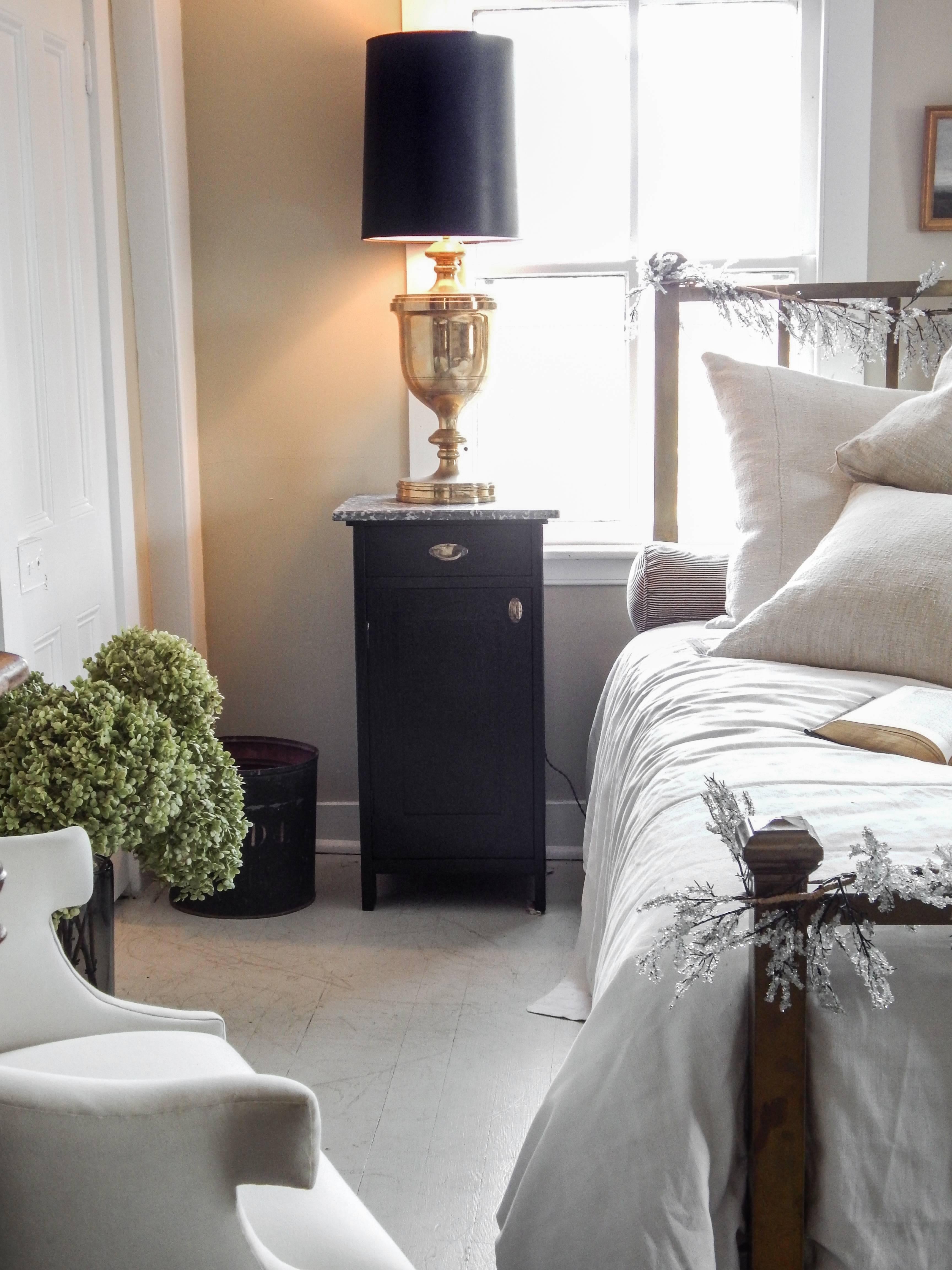 Pair of newly ebonized nightstands with marble tops and great brass hardware.