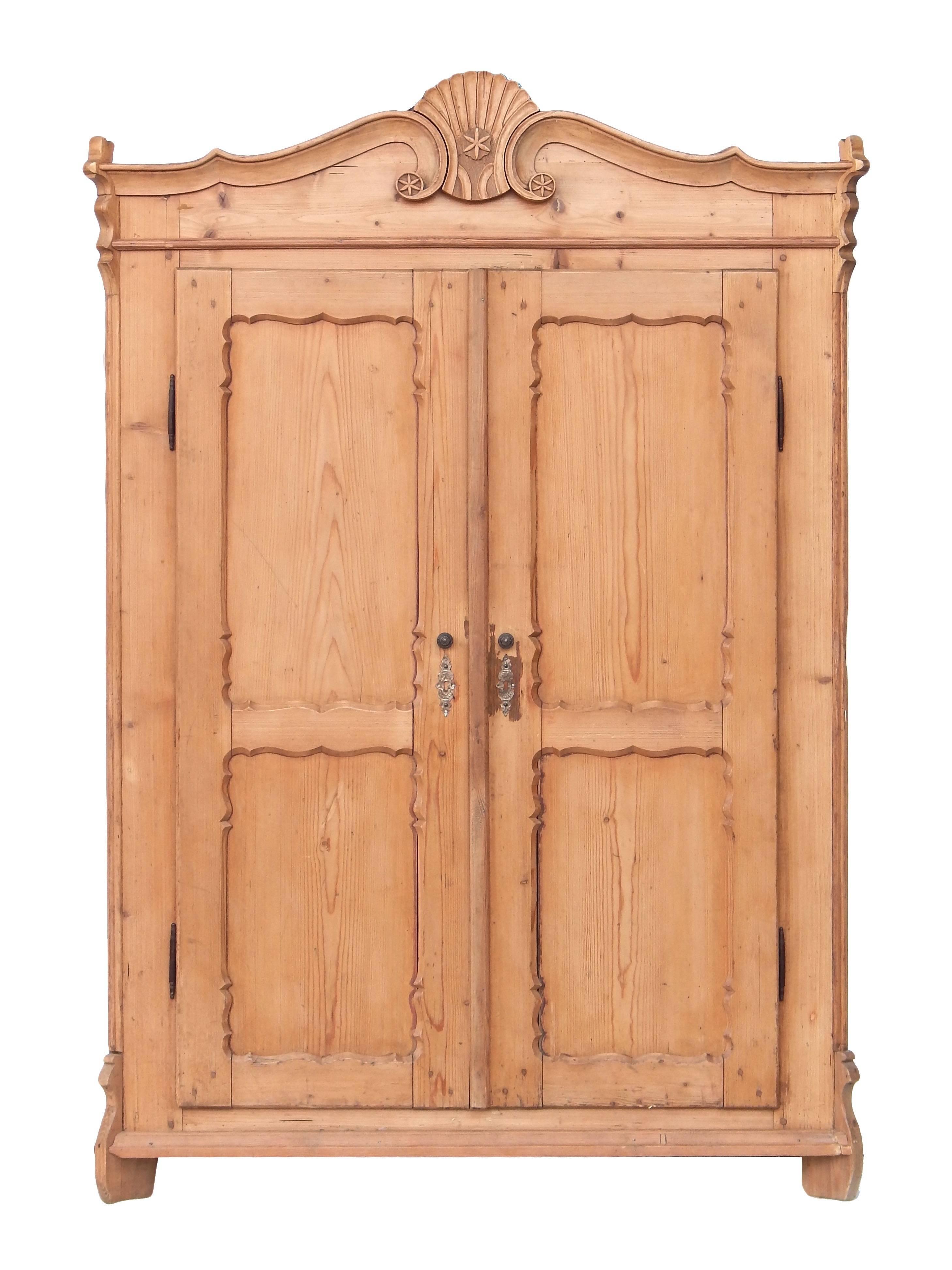 Beautifully detailed European pine double door armoire with shelves and room for hanging (there are pegs but we can install a bar if desired). This is a small scale piece that would be perfect in a guest or child's room.