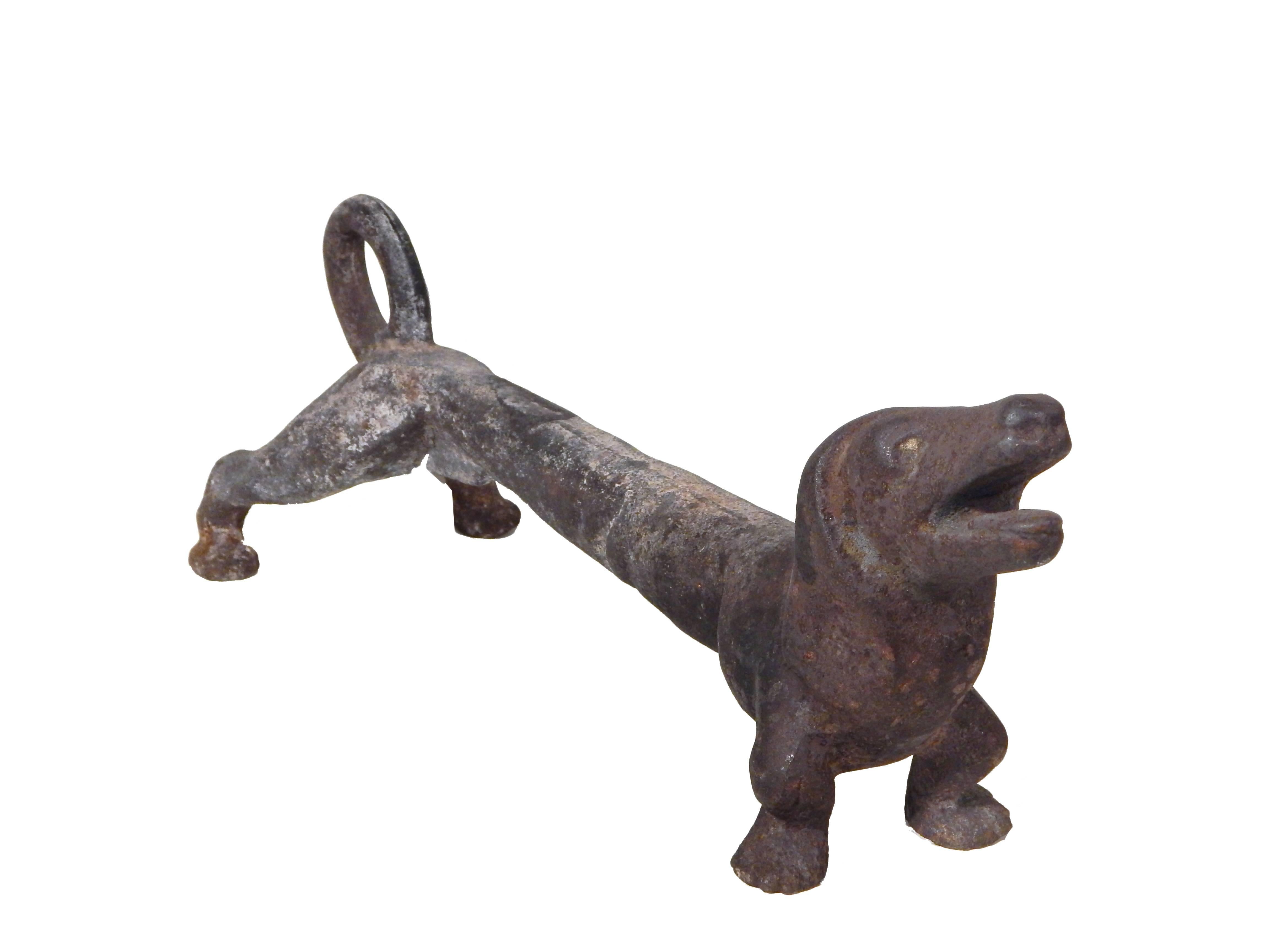 Pair of cast iron with nice age patina. Dachshund andirons.