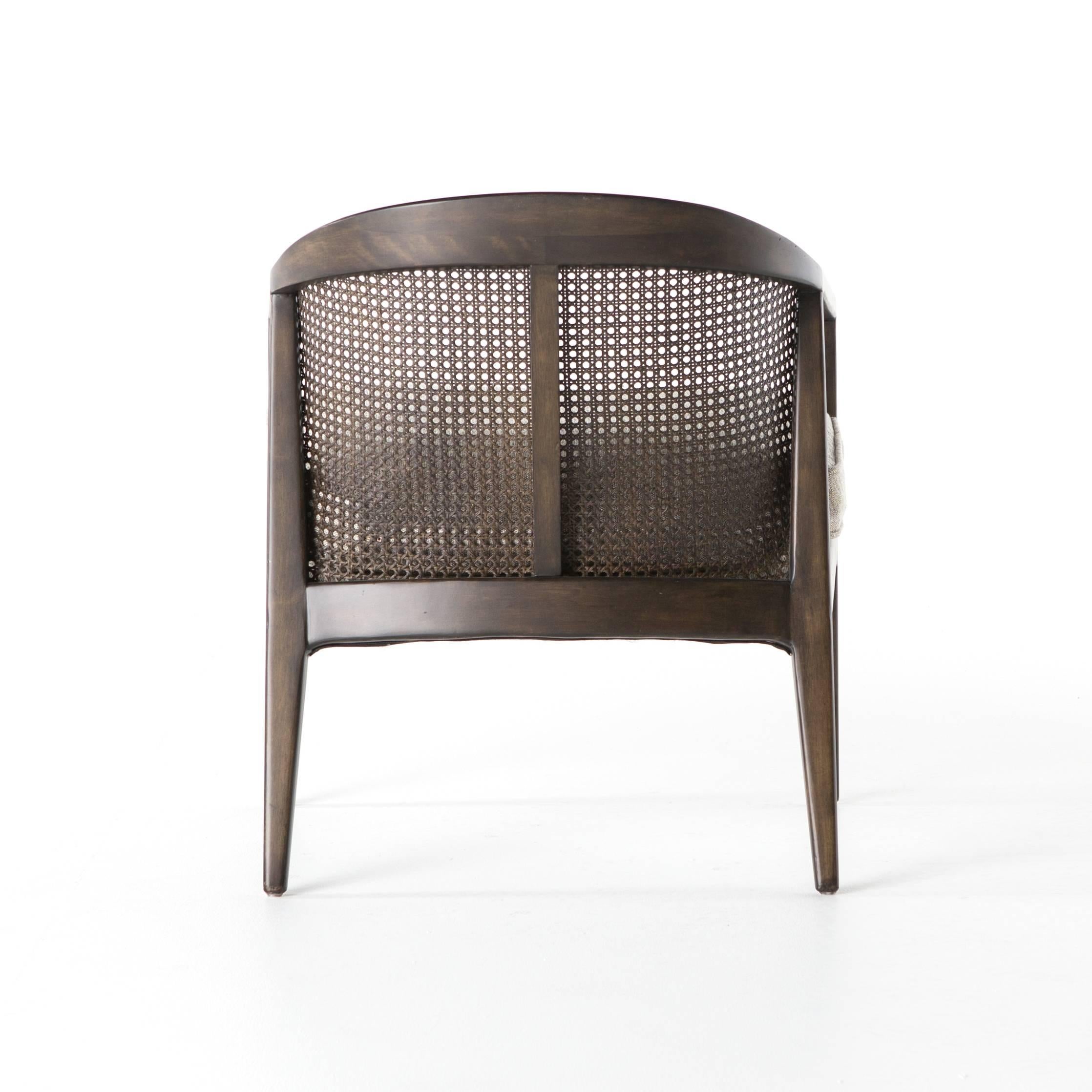 Mid-Century Modern inspiration, sleek, hand-shaped birch framing is accented by textural woven rattan back.