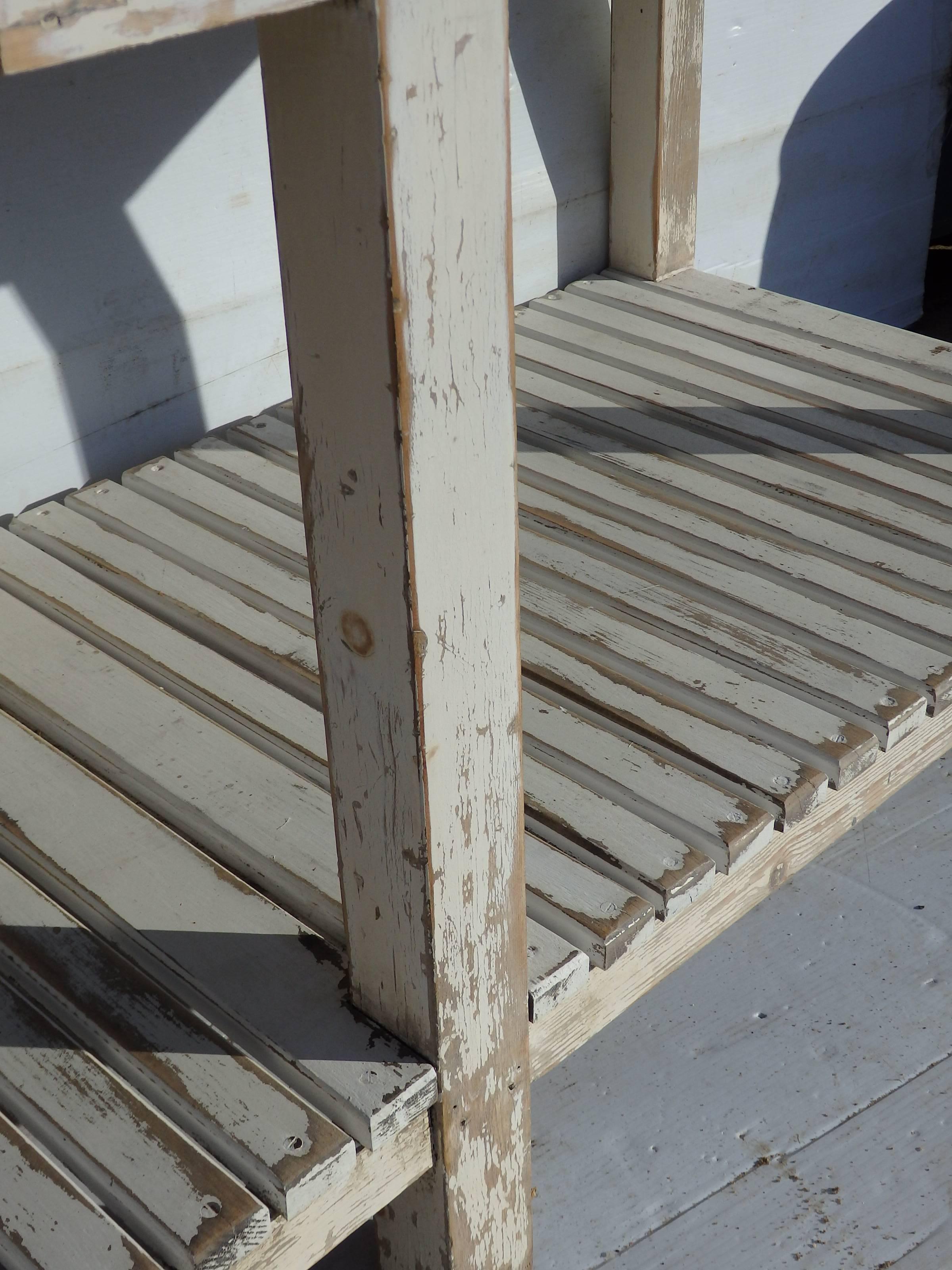 Painted French early 20th C French florists table with original zinc top and 2 drawers, slatted base.
table height 33