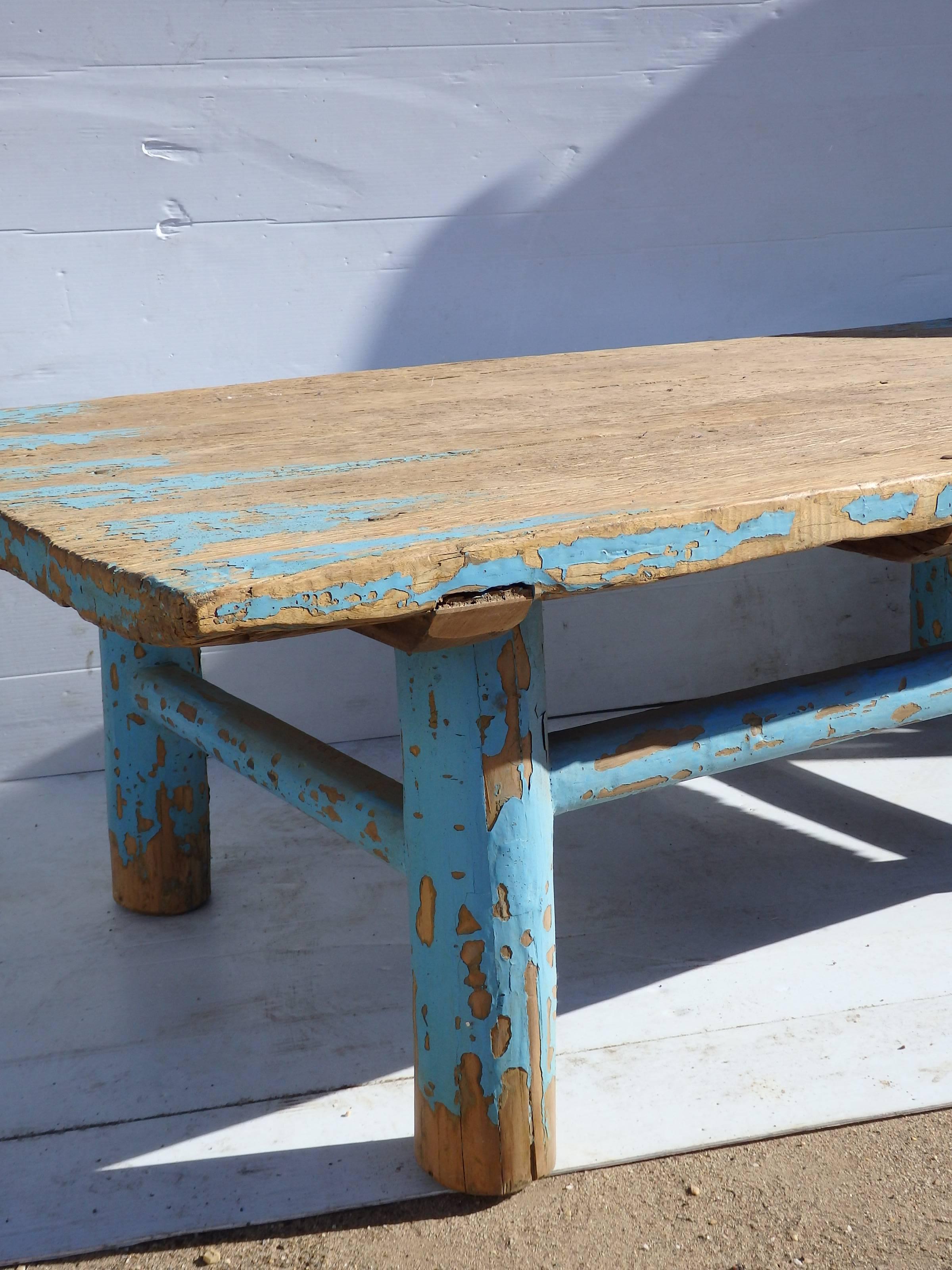 Primitive Chinese coffee table with remains of original bright blue paint.