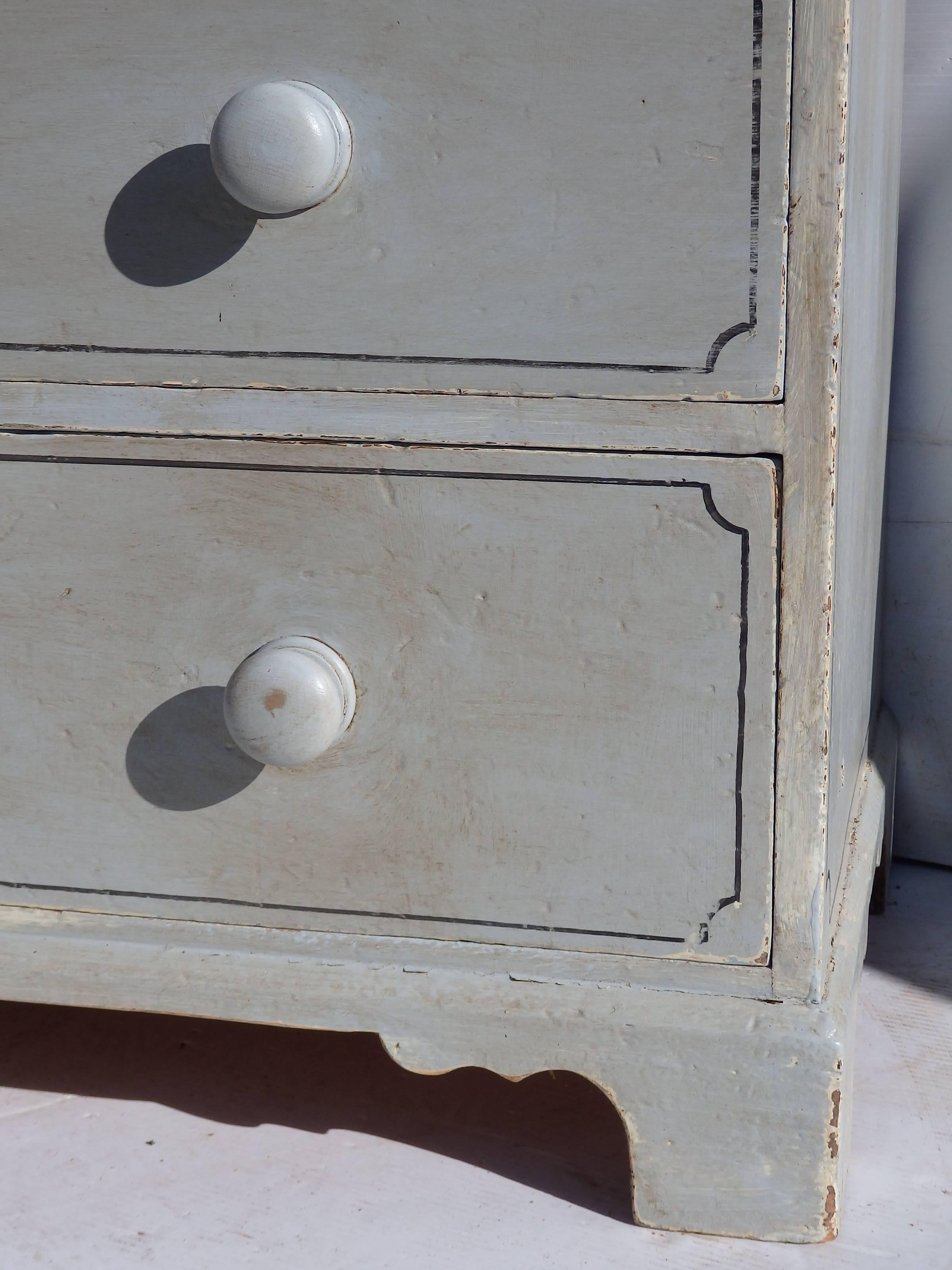A 19th century English pine dresser, that has been recently painted in a blue grey finish with stencil details.