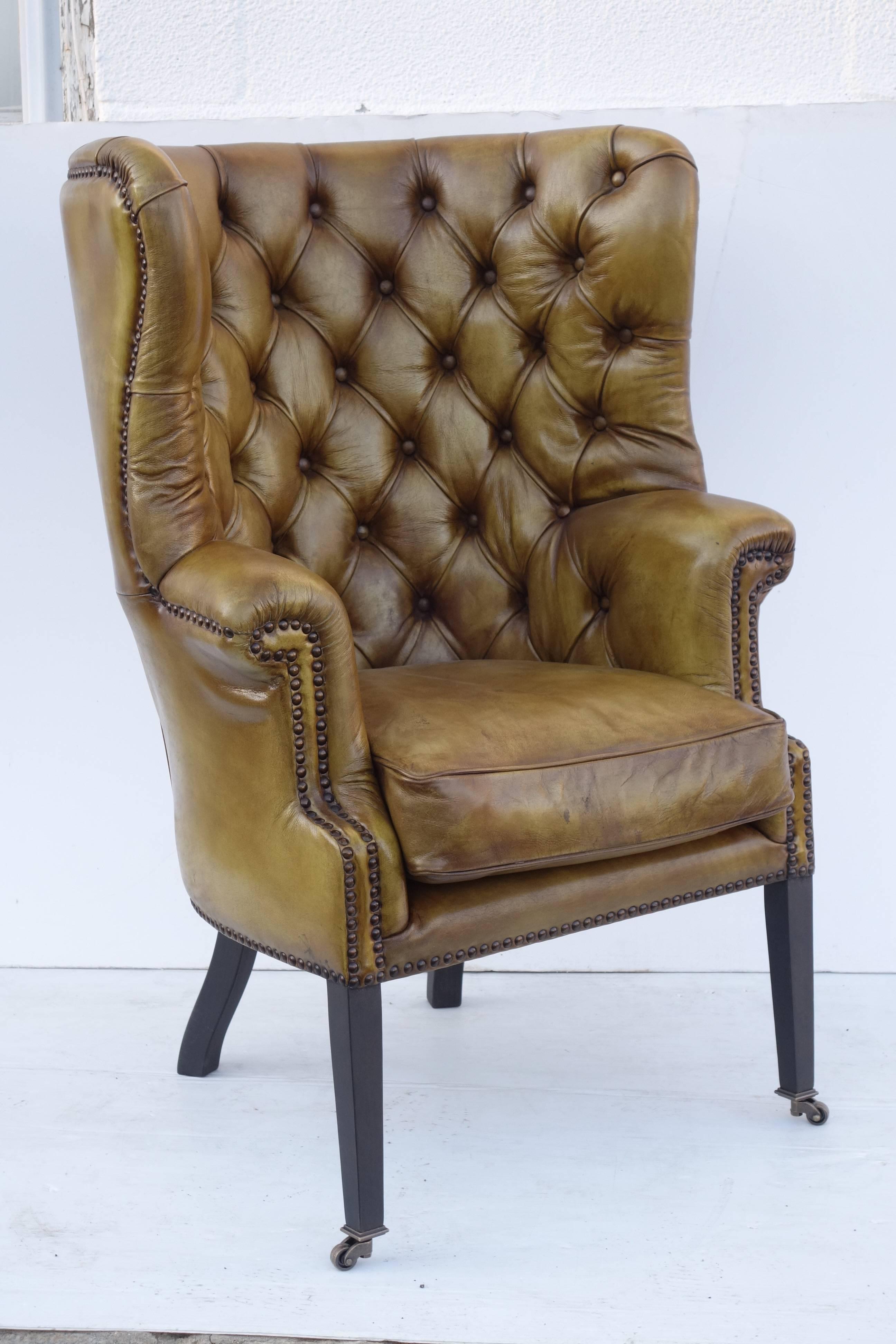 Upholstered Wing Chair in Vintage Green Leather In Excellent Condition For Sale In Bridgehampton, NY