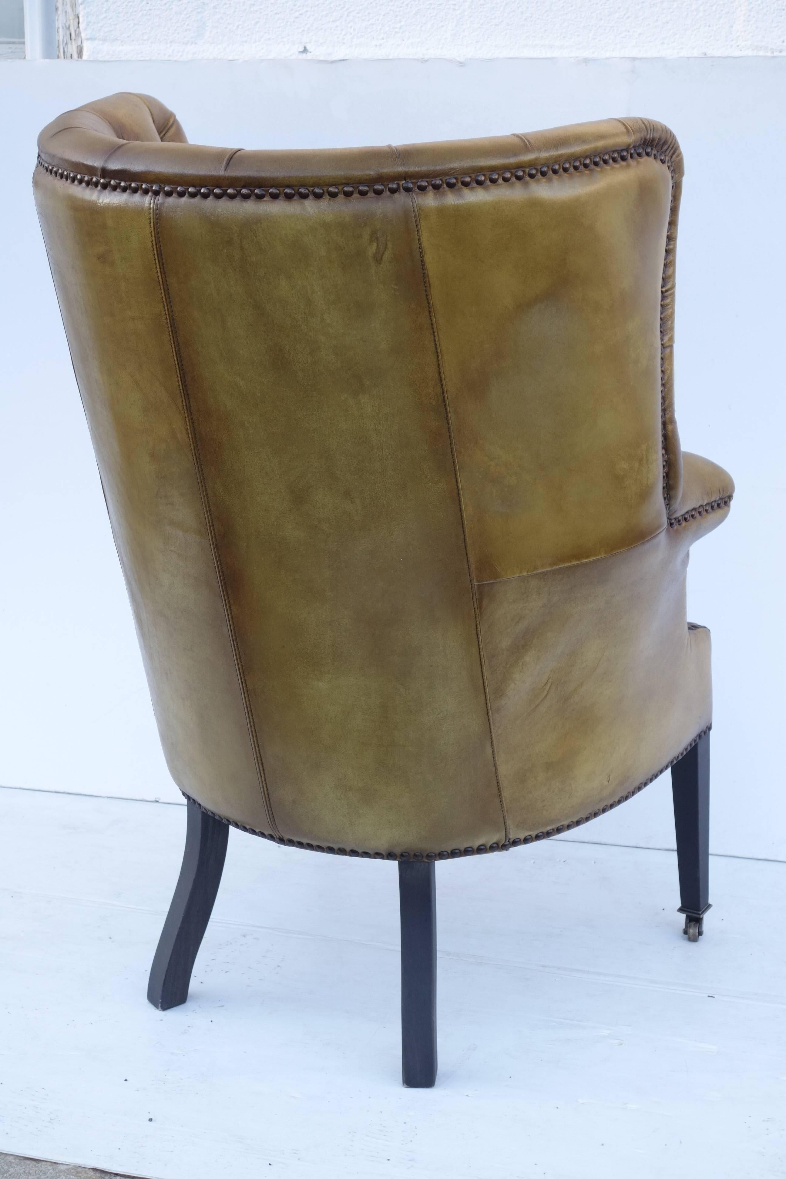 Upholstered Wing Chair in Vintage Green Leather For Sale 1