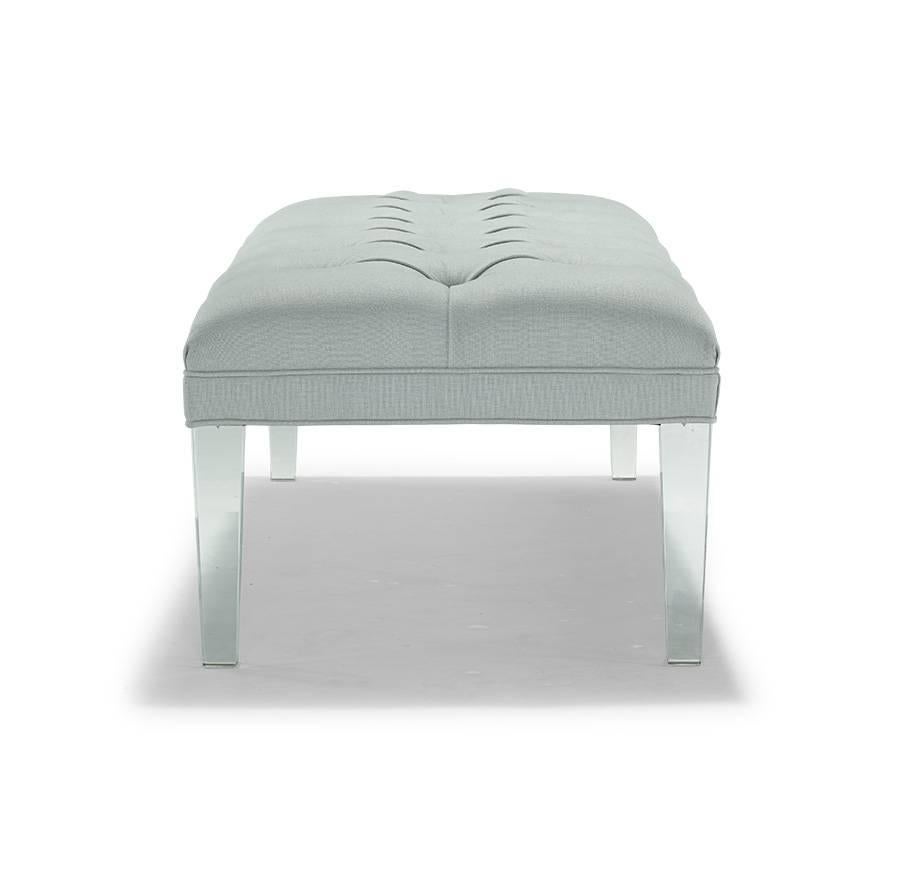 Features tall tapered acrylic legs and deep diamond-tufted top, finished with a thin welted border. 

Available in fabric or leather, it is part of a collection of ottomans that also includes a 21” cube and a 40” square.

Shown in grade