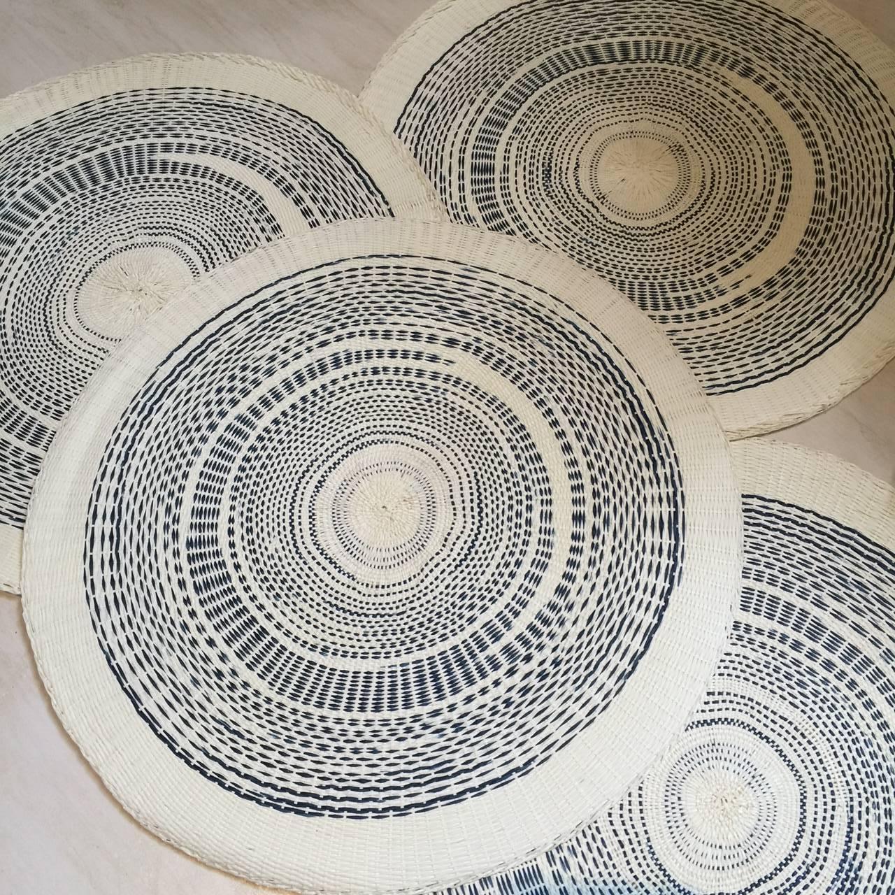 Indigo and ivory woven paper place mats in two designs, sold in sets of 4.
15