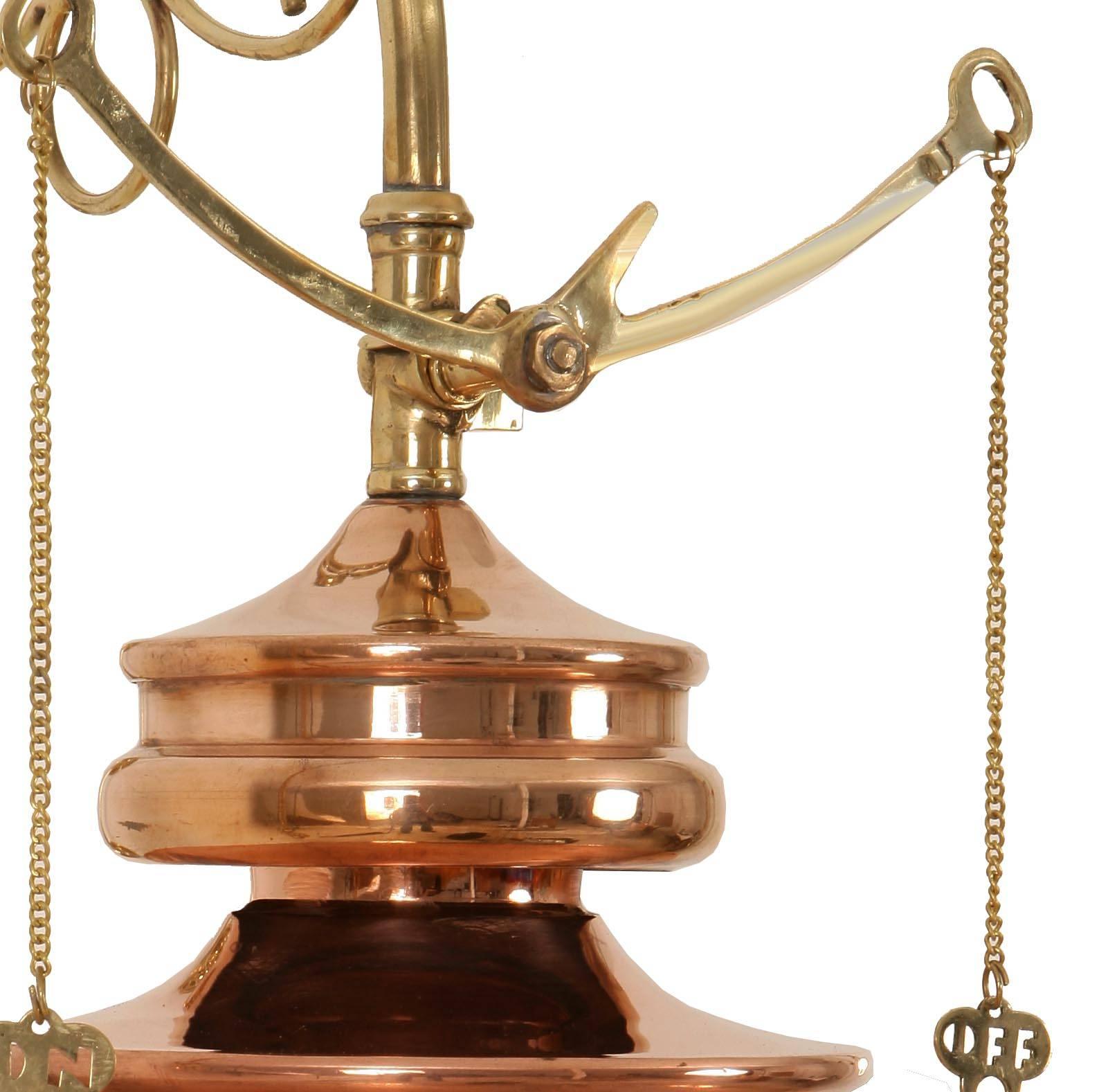 This pendant is a replica of gas railway station pendants, circa 1890s. Solid copper with brass detail shown in AB distressed finish. Suitable for exterior use.