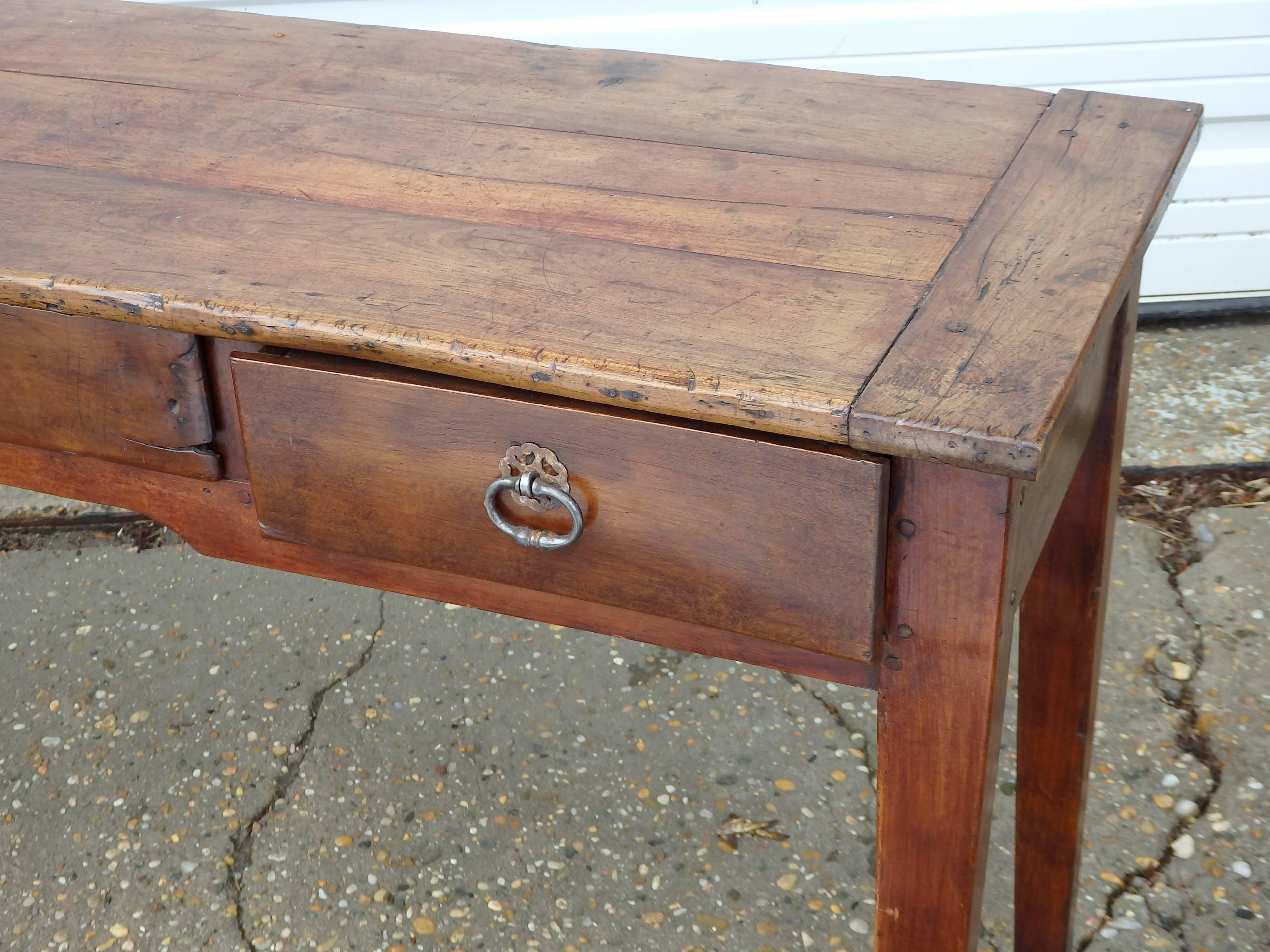 19th century French table with three drawers, breadboard ends and tapered legs. Would make a great desk or console or hall table.