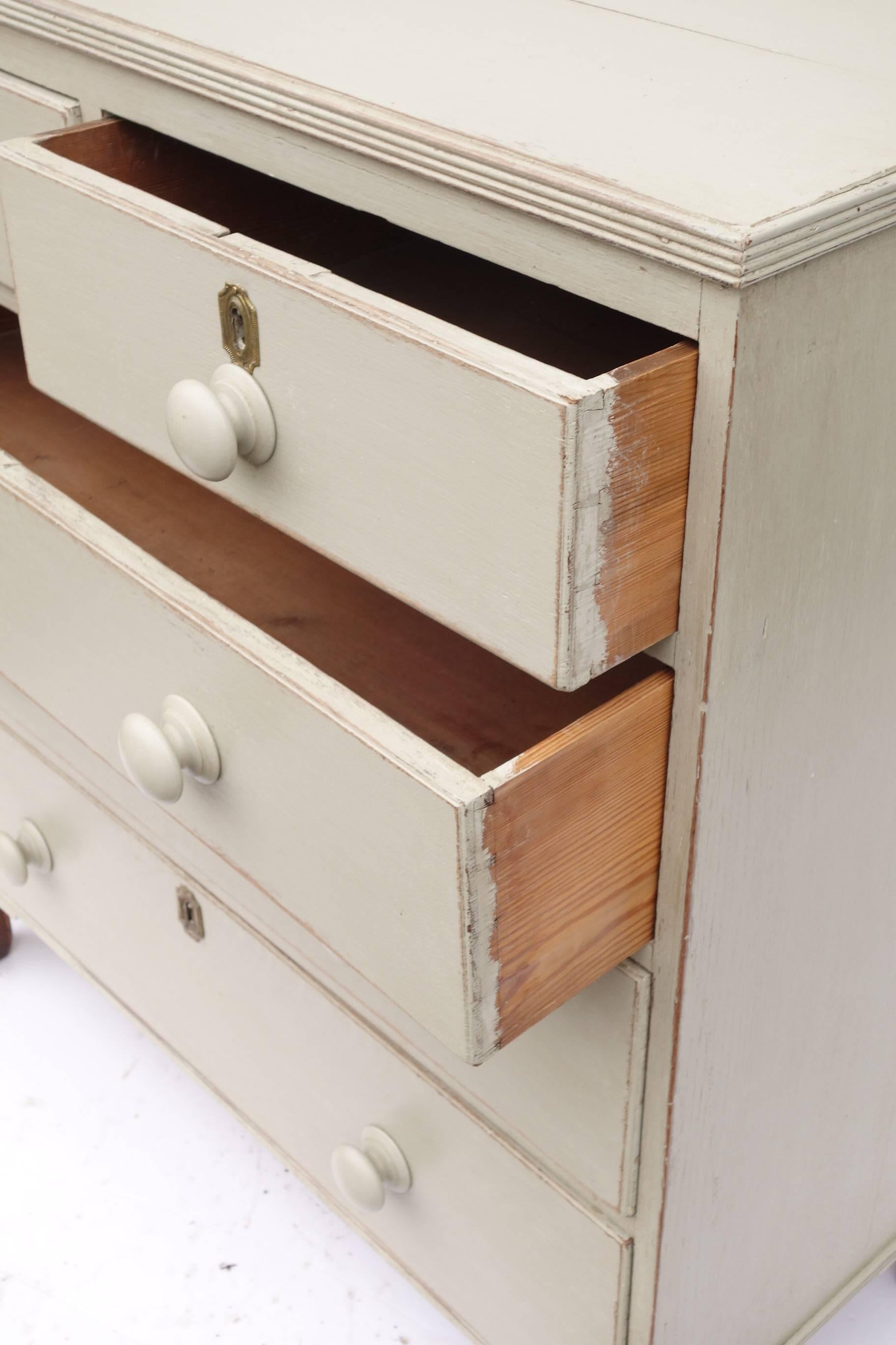 Painted English dresser with turned wooden handles. Recently re painted in pale grey.