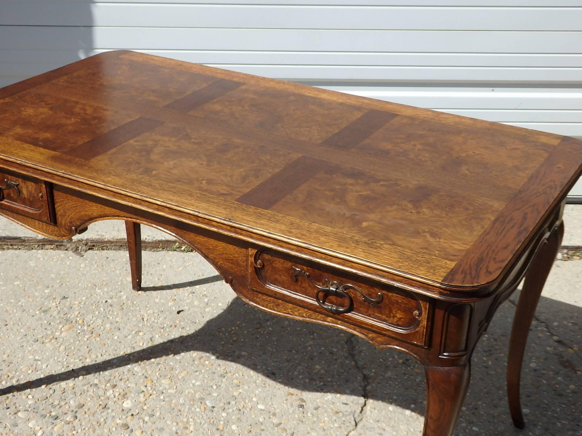 A charming ladies writing table, with two-hand carved drawers and old brass pulls. Cabriole legs, burl walnut top, walnut base, circa 1860.