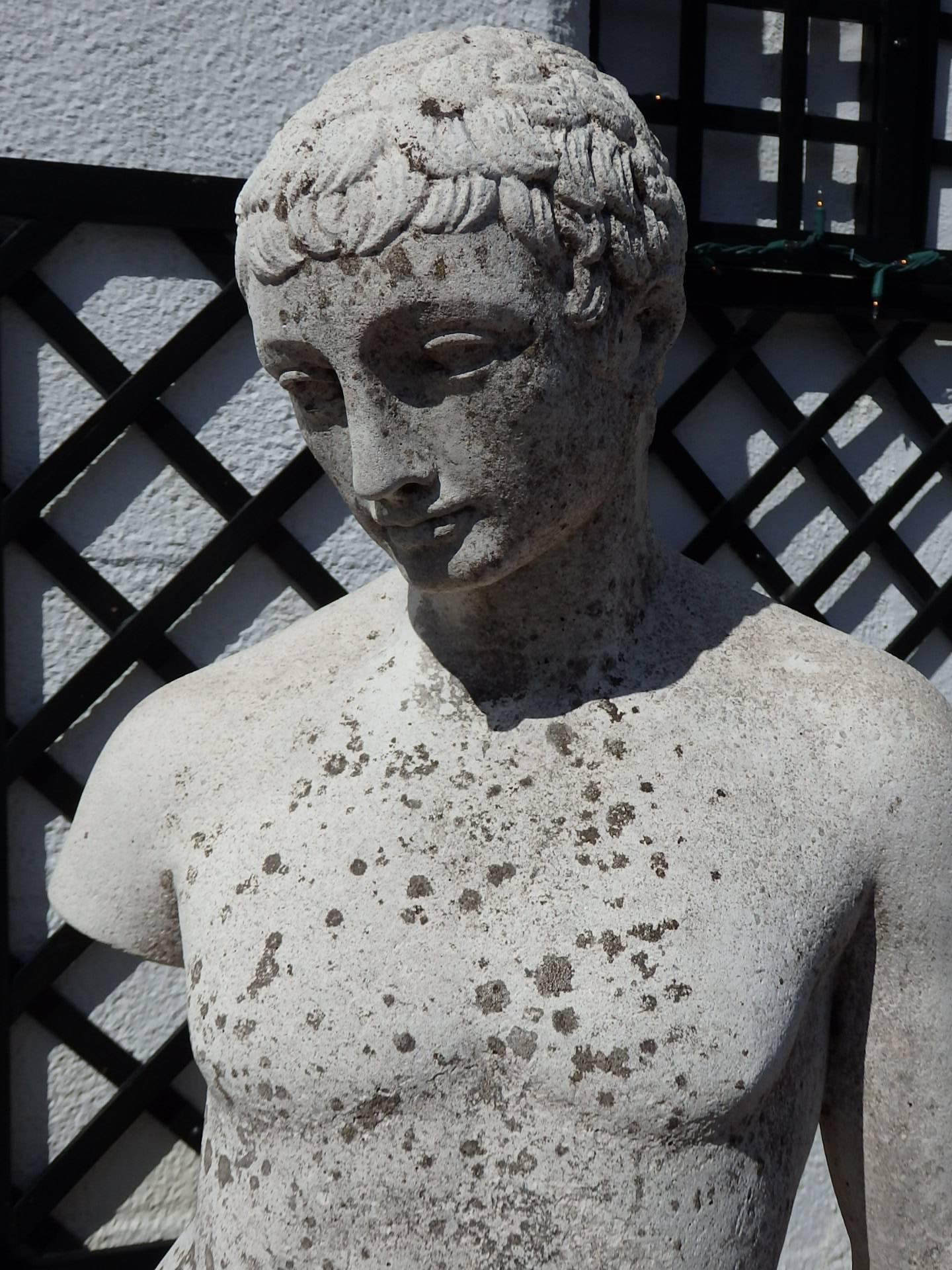 Early 20th century statue of a young man with Roman style hair, composite stone, circa 1930