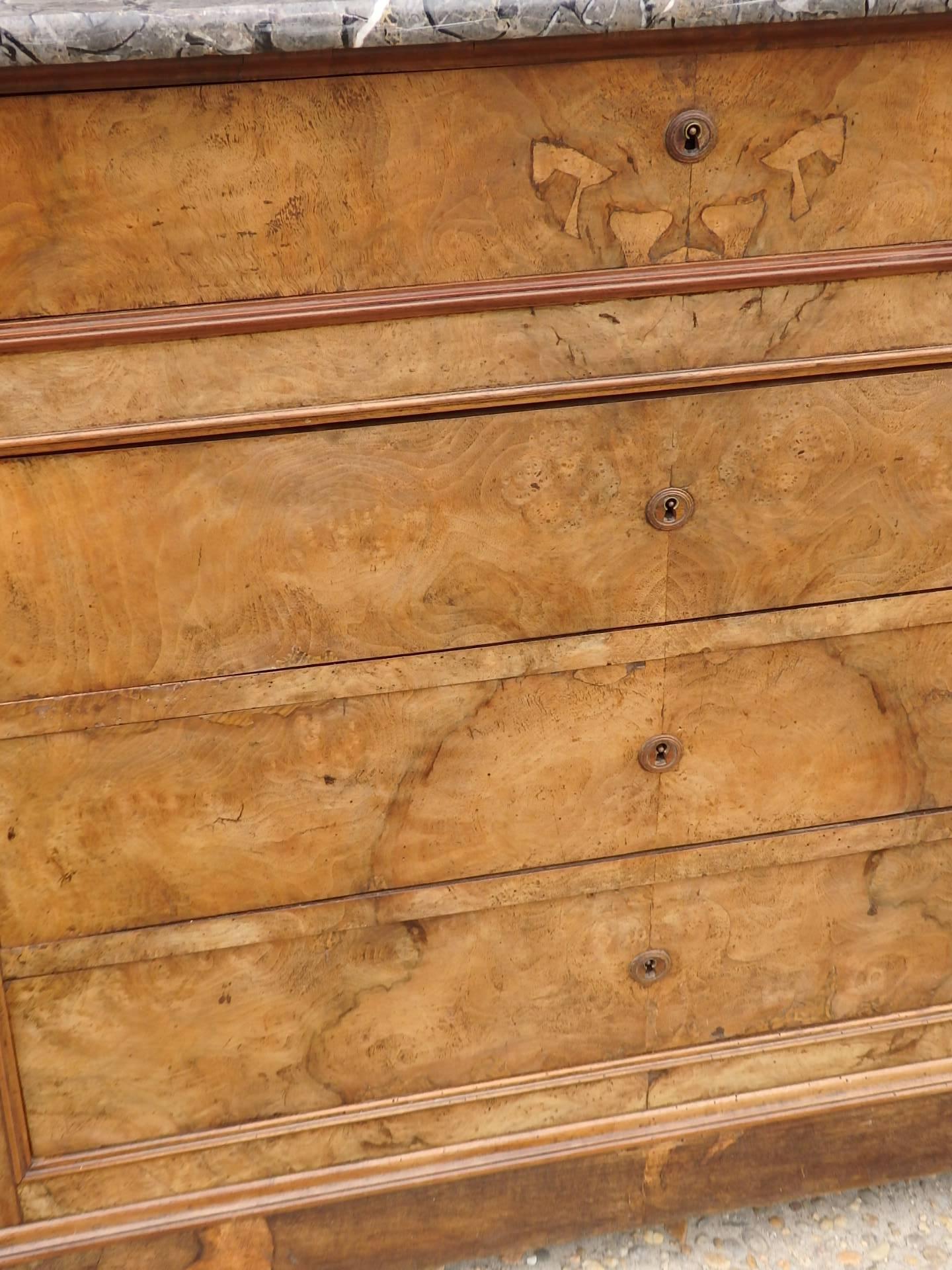 A French 19th century Louis Philippe dresser in burl walnut and original marble top.
