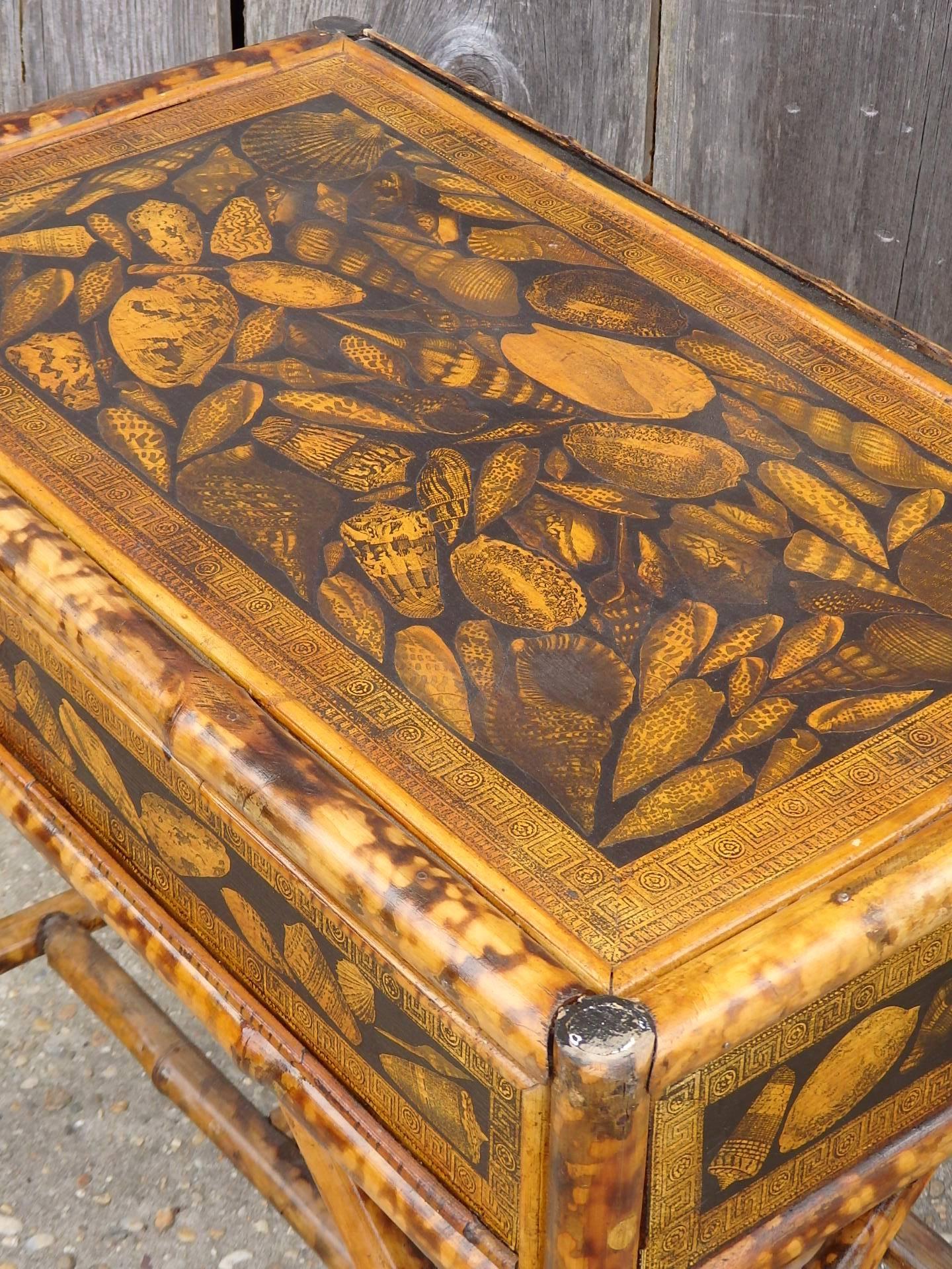Small French, circa 1930 bamboo table with later applied decoupage shells.