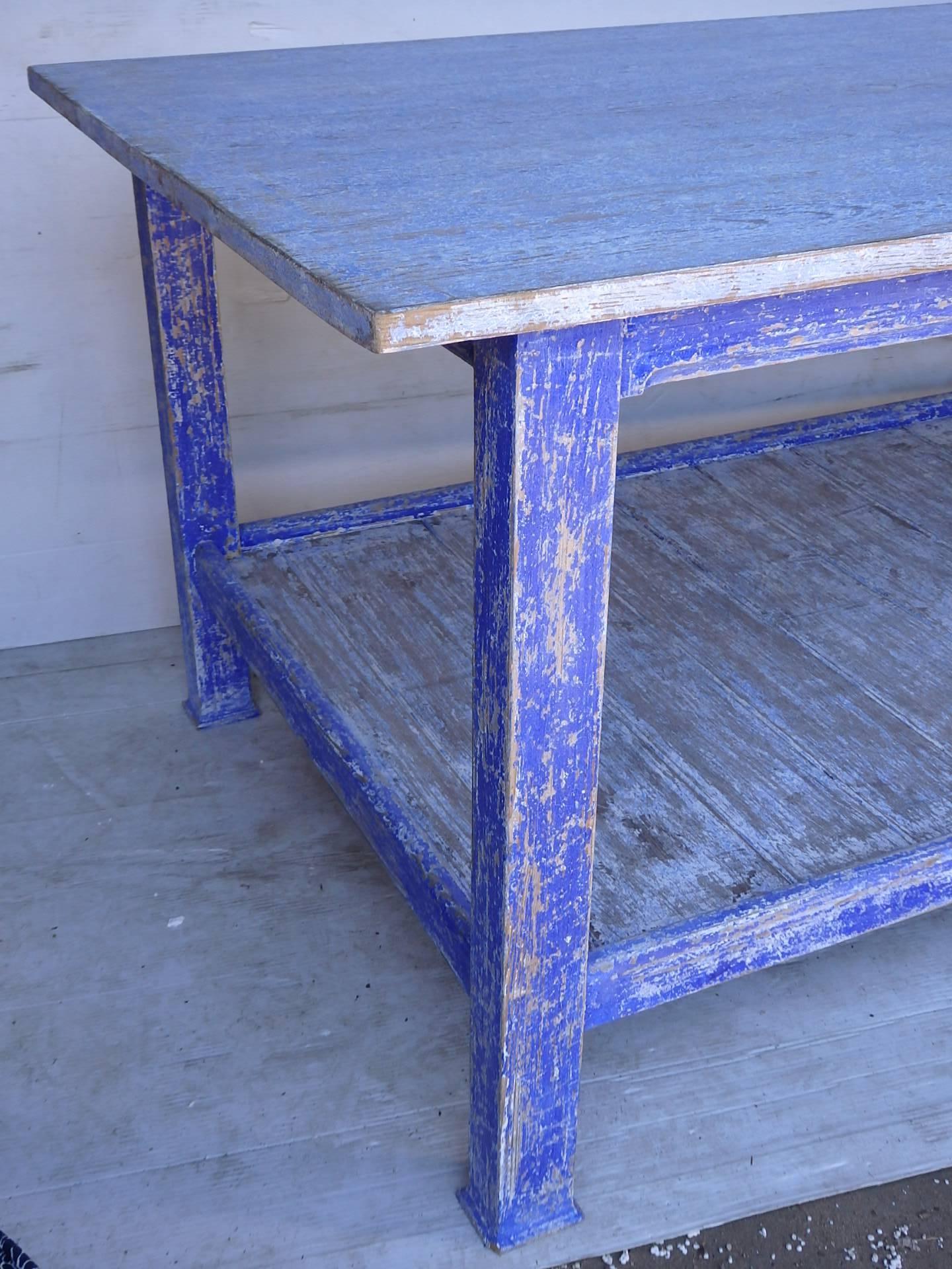 A large painted work table with old blue paint, great work table or centre island,
circa 1920.