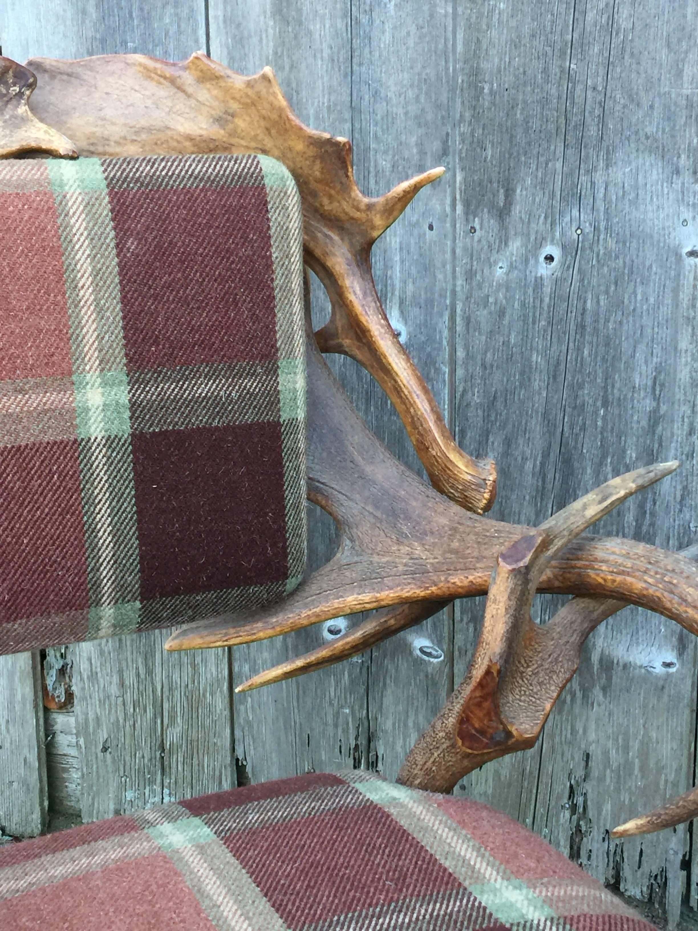 Scottish red deer Horn armchair with wool tartan upholstery.