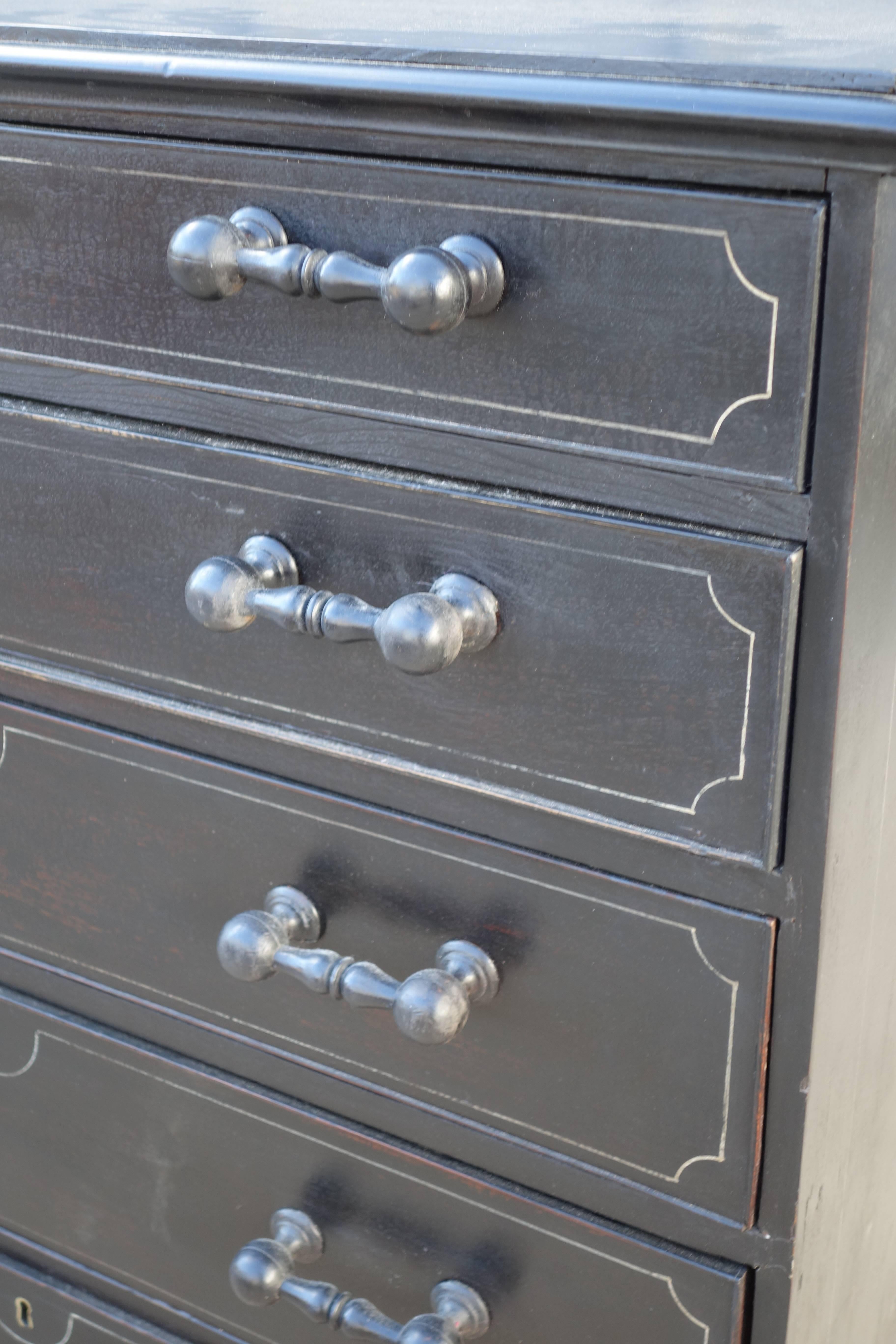 English dresser in ebony paint finish, with faux moulding detail, and unusual handles.