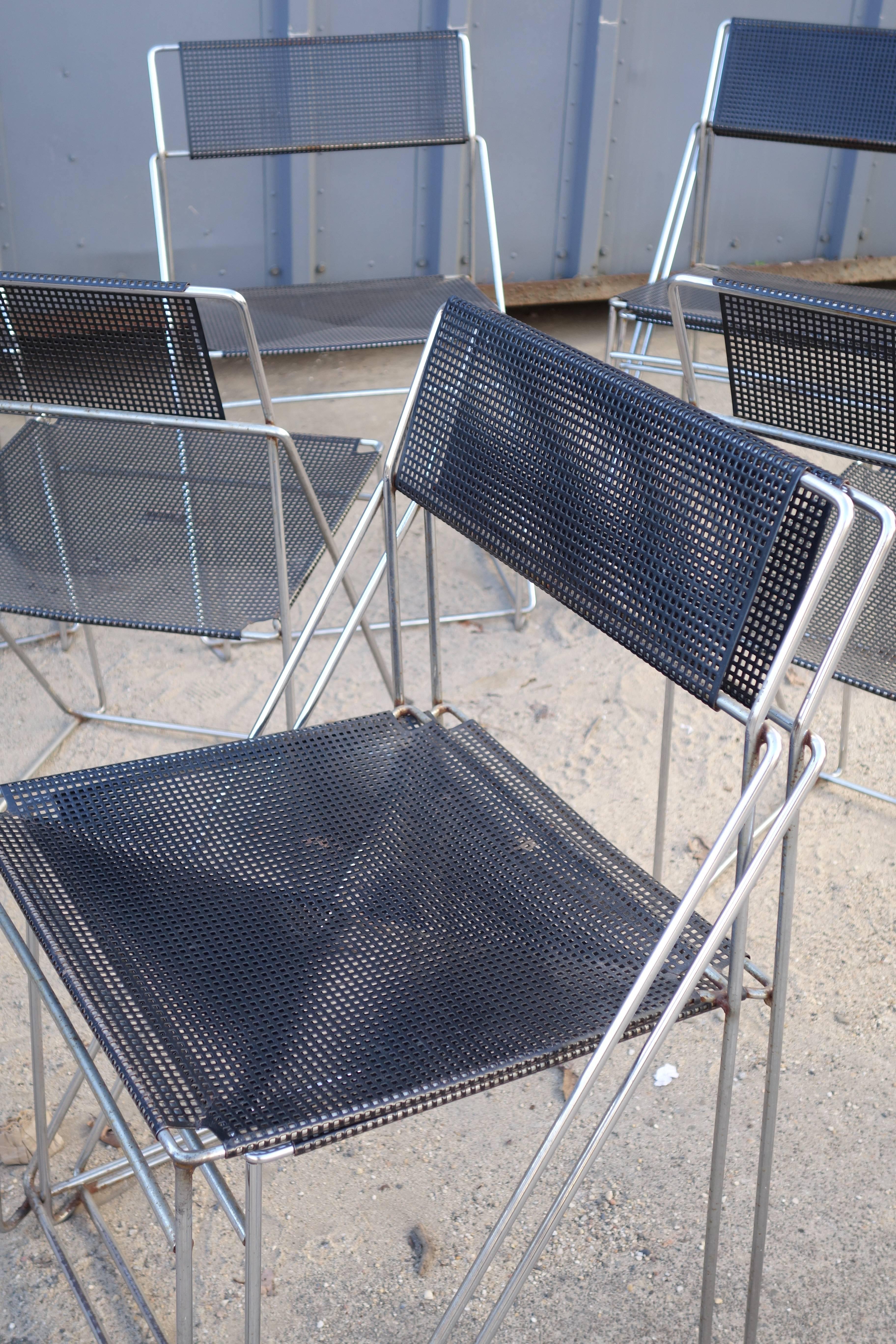 Set of ten Dutch dining chairs with pierced metal seats and backs in black,
circa 1950.
 