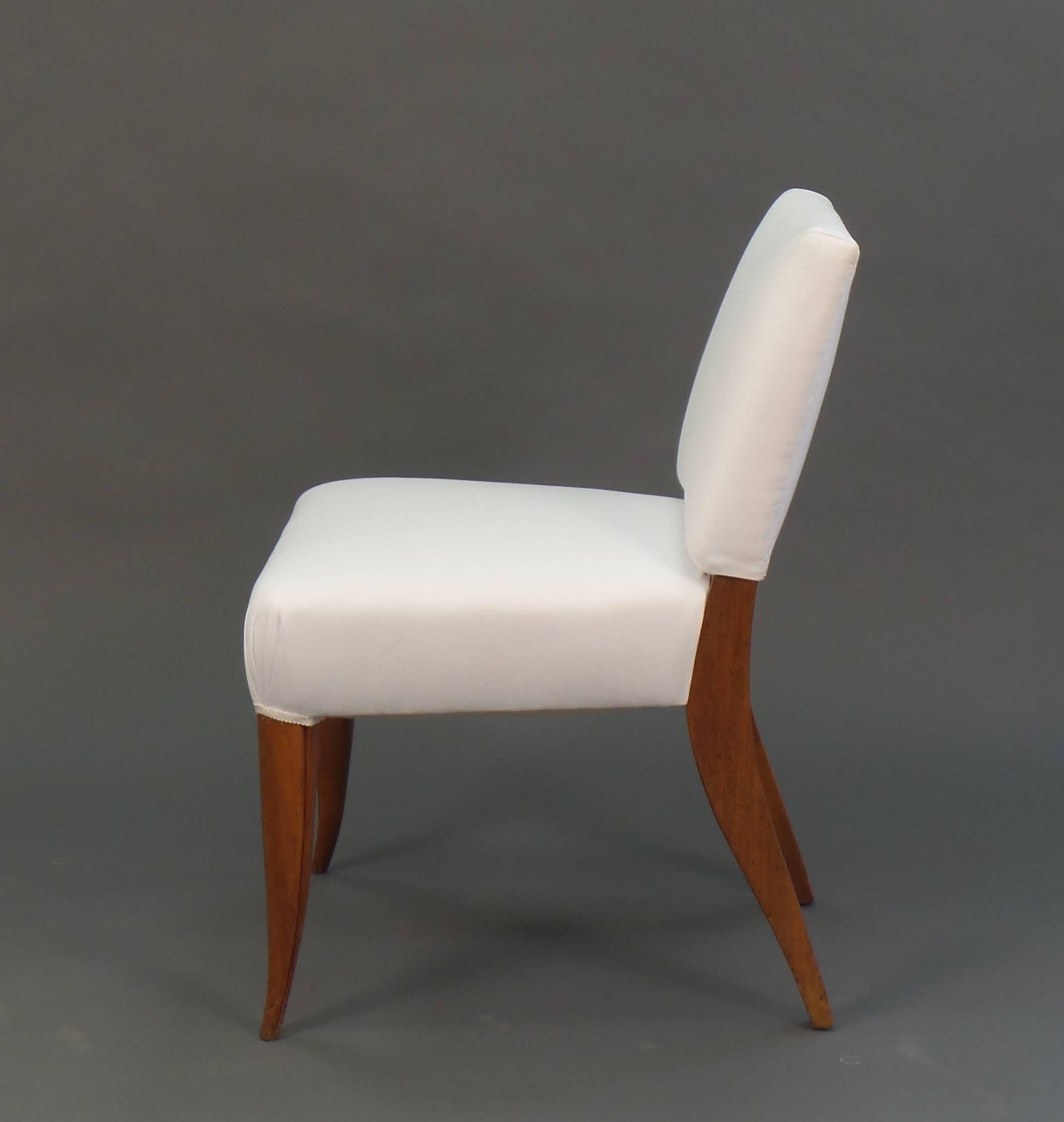 A graceful Art Deco style side chair with shaped sabre-form front legs. Shown in muslin. Custom finishes and upholstery options available. Approximately 6 - 8 weeks lead time, please confirm and notify Victoria & Son of any deadlines.