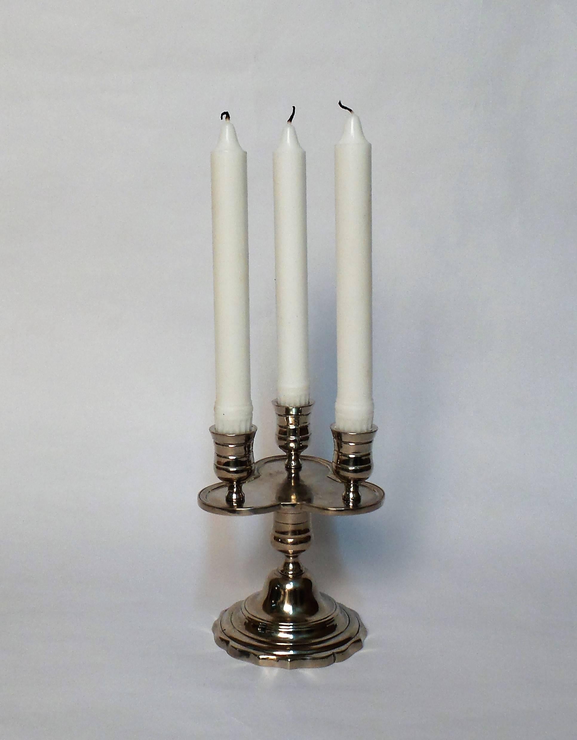 A limited edition in white brass of Victoria & Son's Trefoil candlestick model.