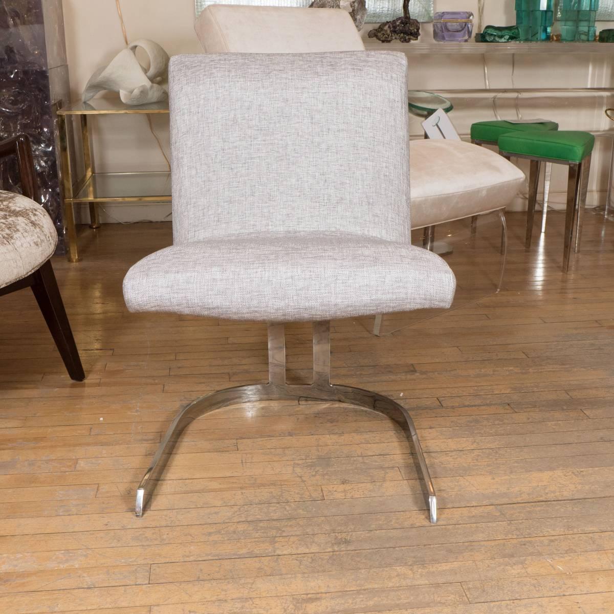 Pair of petite chrome upholstered cantilevered chairs.