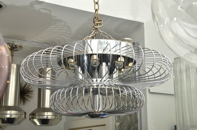 Stainless steel ceiling fixture with two tiers of coil detailing.