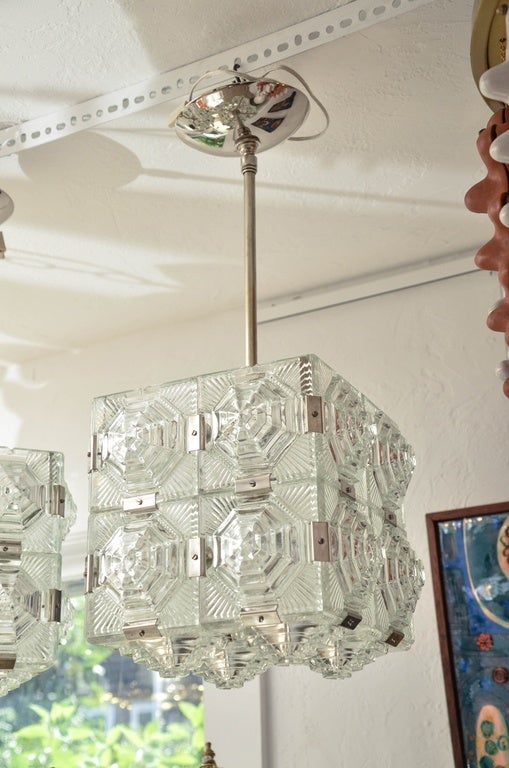 Cubic pendant fixture composed of textured glass square elements with nickel detail in the style of Kalmar.