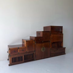 Vintage seven-piece modular, solid wood tansu chest with brass details