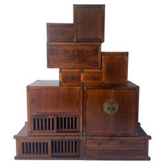 Vintage seven-piece modular, solid wood tansu chest with brass details