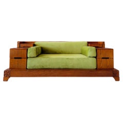 Brutalist vintage oak sofa with built-in drawers and green daybed