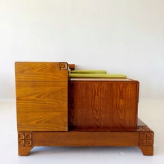 Brutalist vintage oak sofa with built-in drawers and green daybed