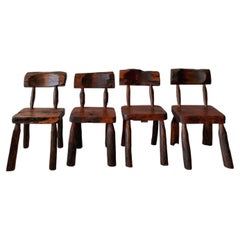 Primitive hand-carved sculptural wood chairs with live edges