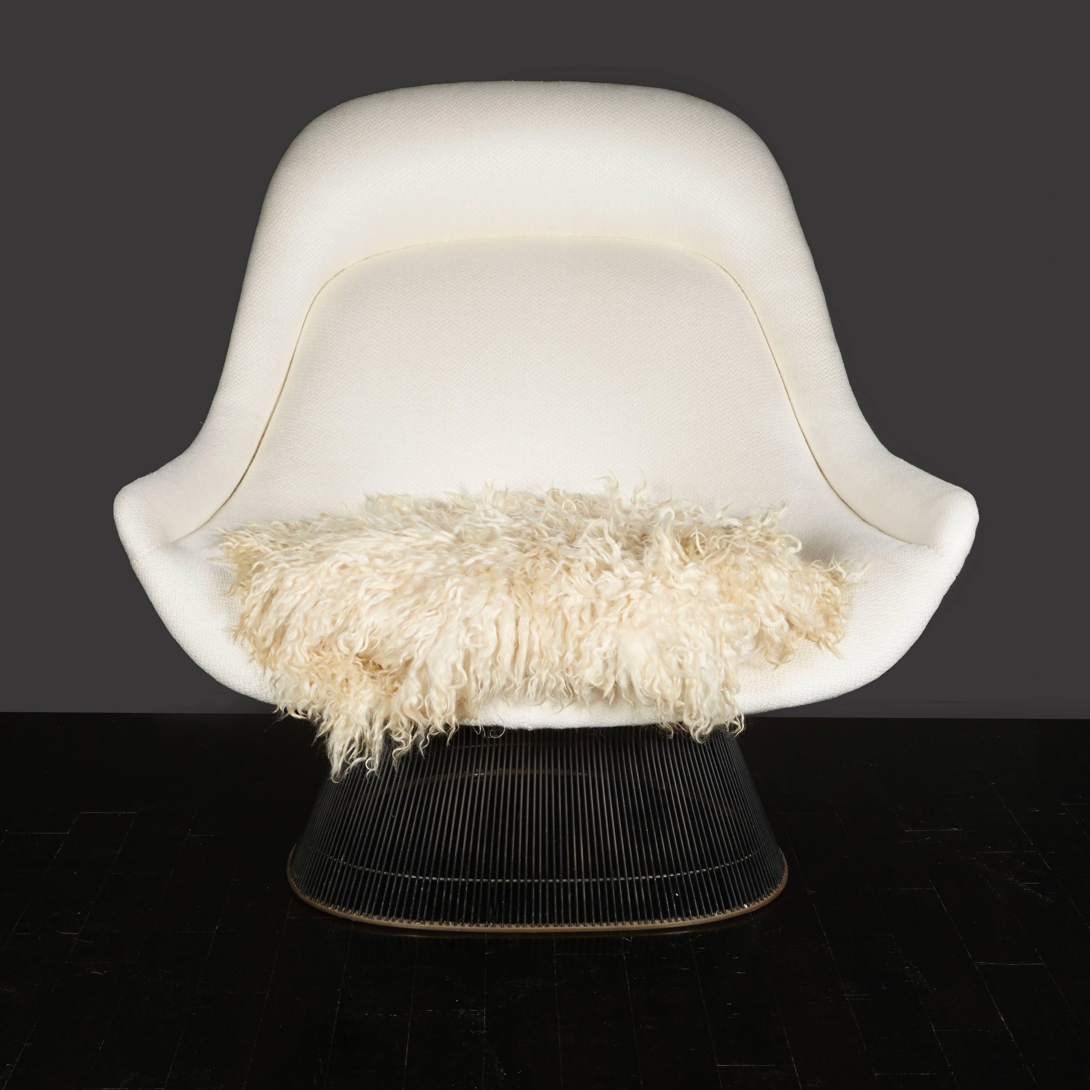 Warren Platner chair with bronze wire - original tag and new upholstery of white nubby linen with an Angora seat cushion.
