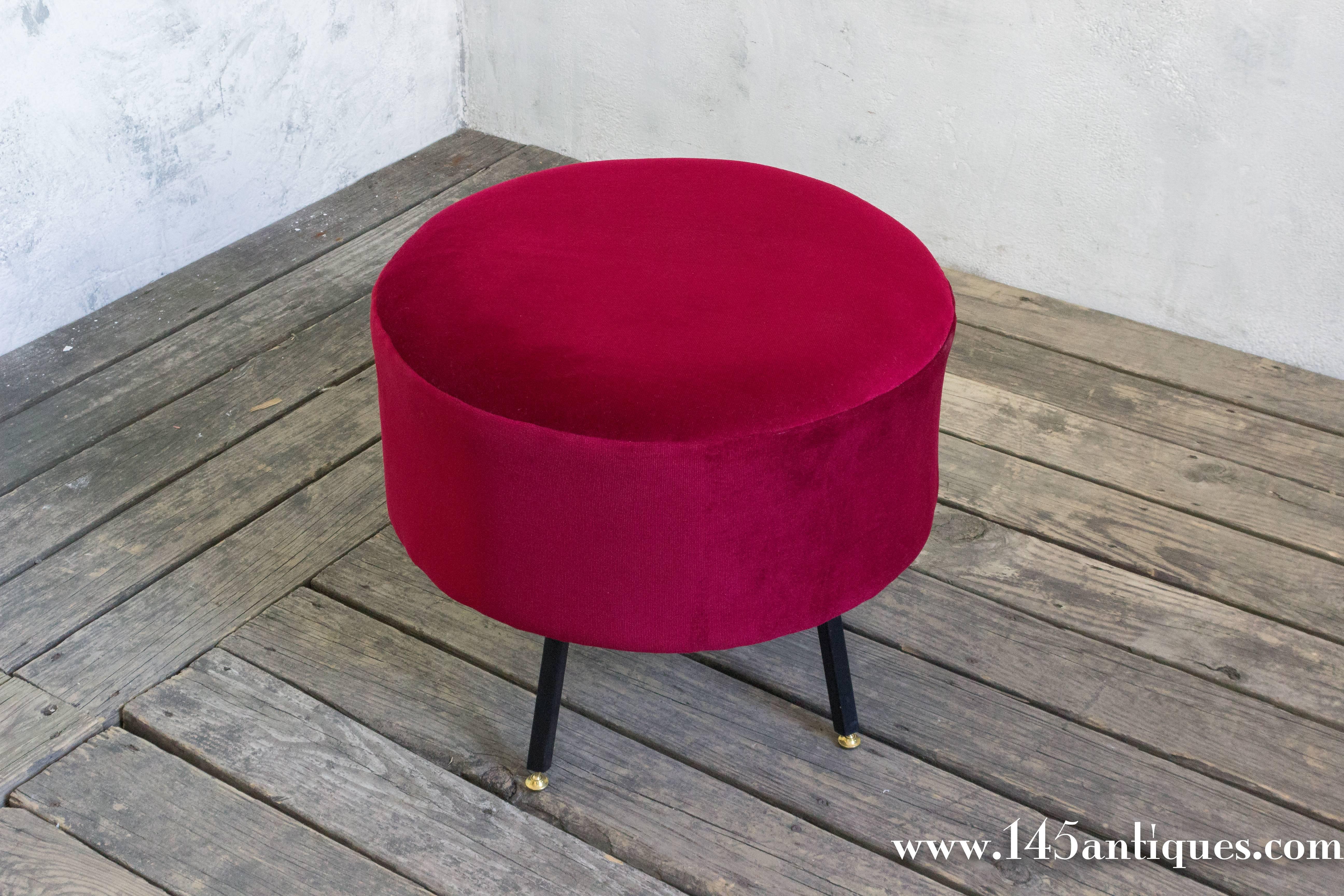 A sleek Italian ottoman in red chenille. Bring a modern flair to your home with this stylish Italian ottoman upholstered in bold red chenille and supported by sleek black metal legs. The contemporary design offers a perfect blend of style and