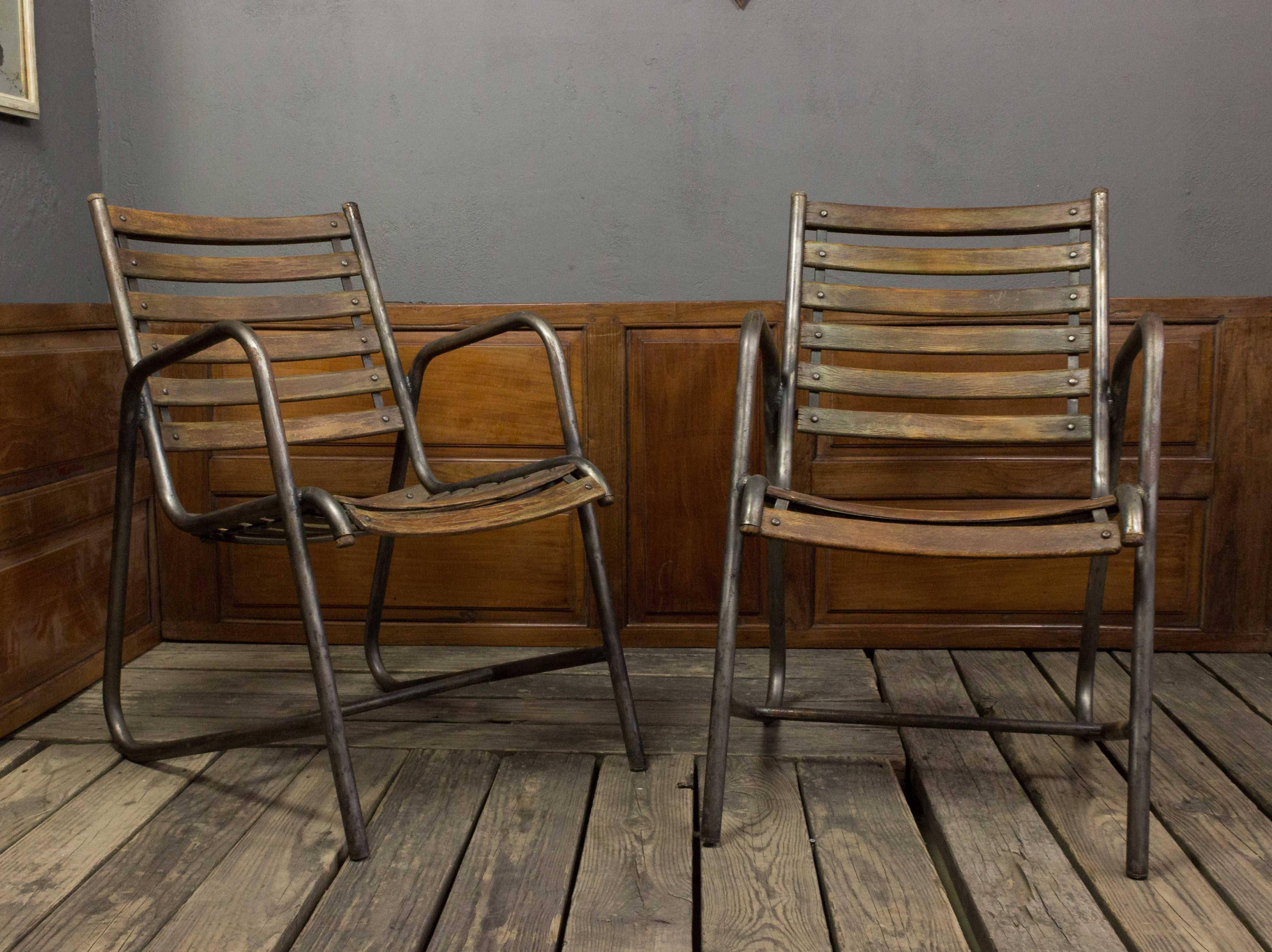 Very comfortable 1950s iron and wood garden chairs.
