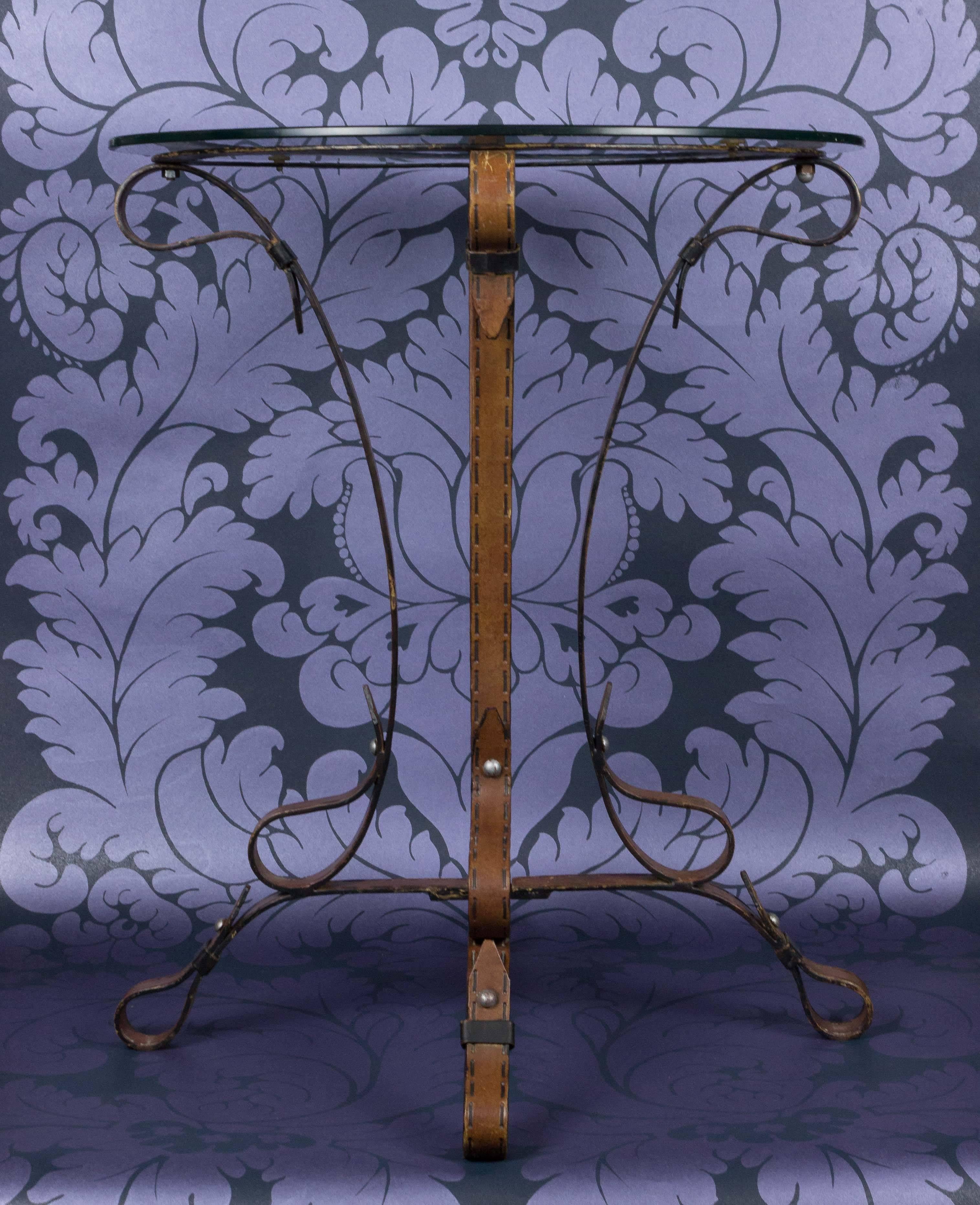 Very unusual wrought iron table crafted to imitate leather. Wonderful French craftmanship!