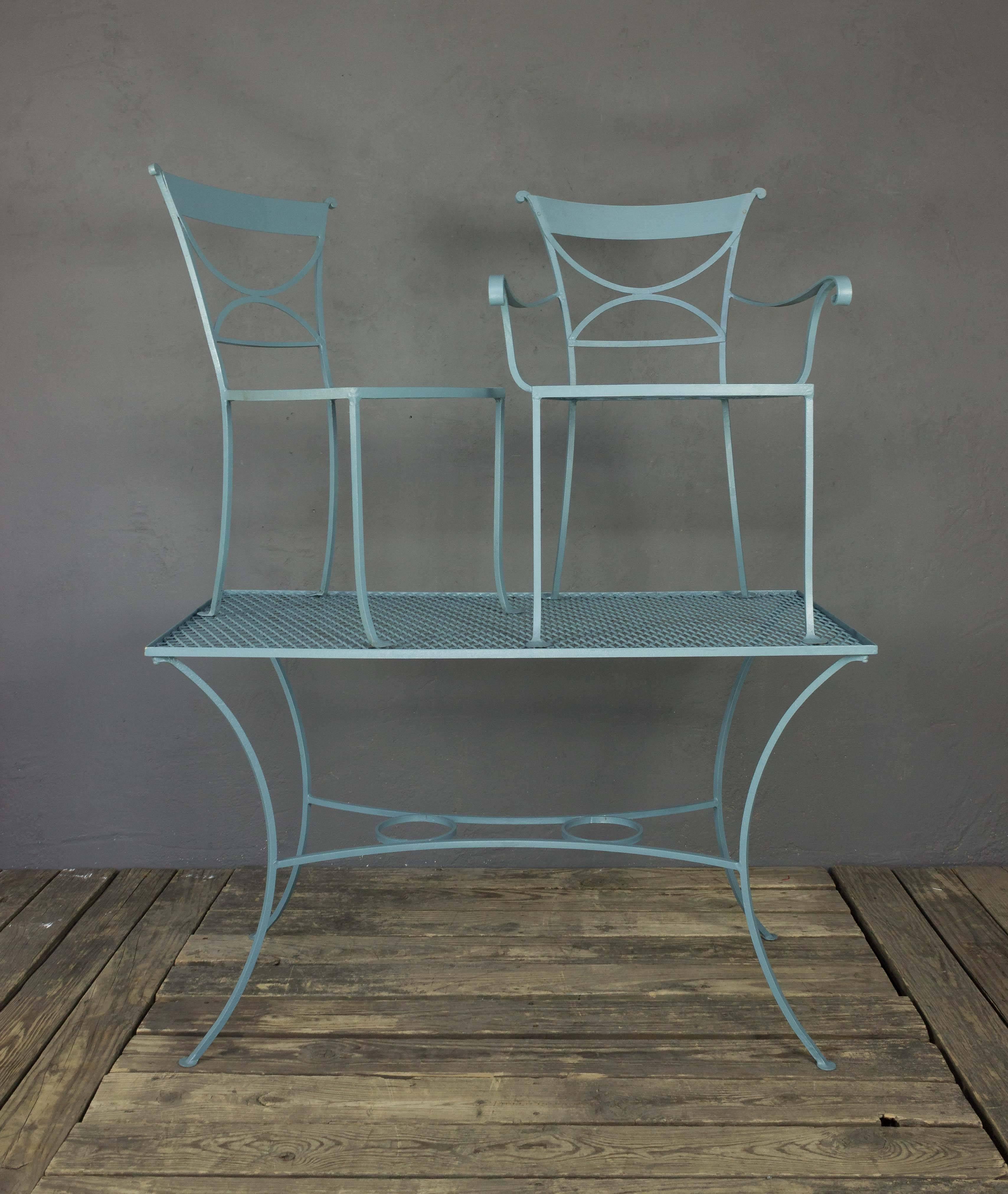 Mid-Century American, painted iron outdoor dining set composed of two armchairs, three side chairs and one table. This set has been updated with new wire mesh and fresh paint.

This price of this item has been reduced. This is the final net