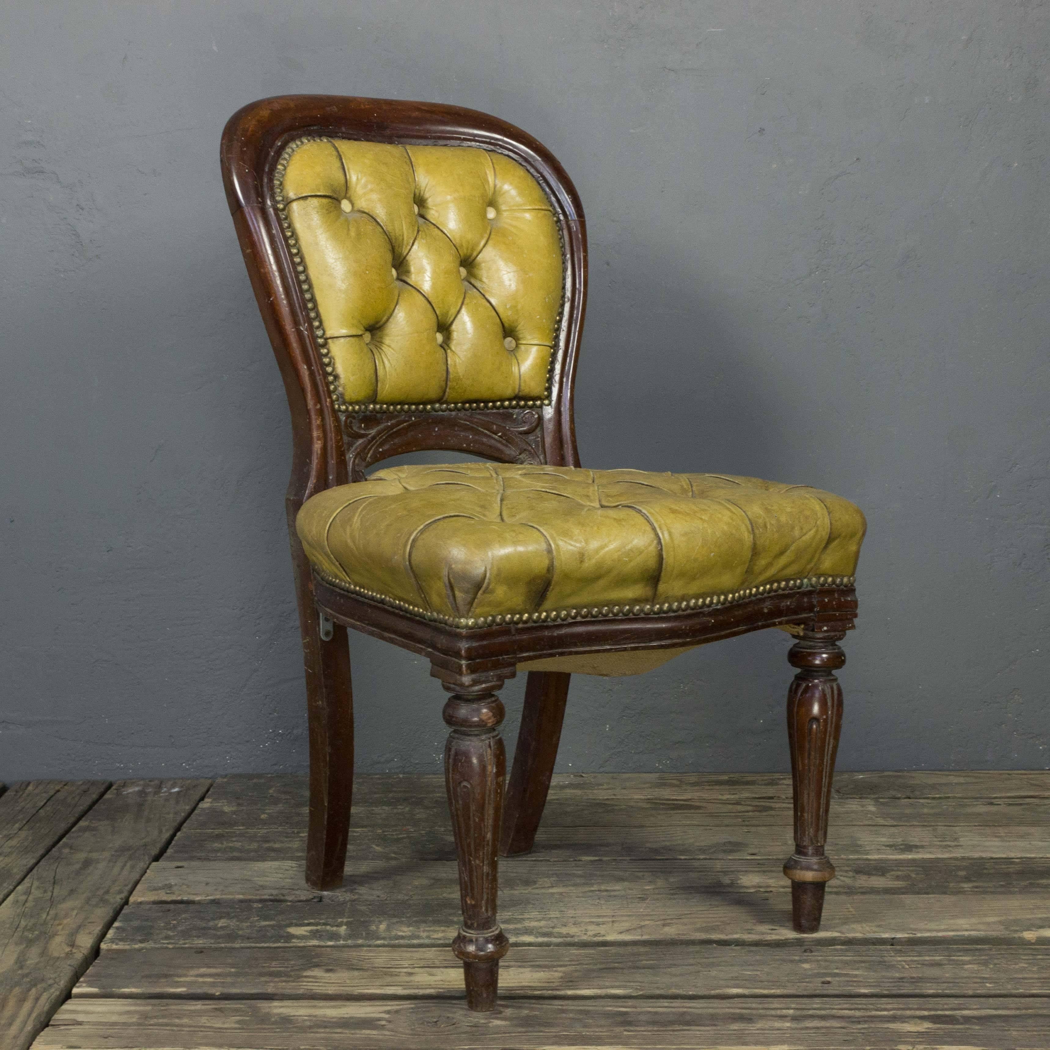 Set of four late 19th century side chairs with tufted leather seats supported on carved and turned legs. Fair condition. Leather is distressed and frames need tightening.

Ref #: SN0317-03

Dimensions: 36