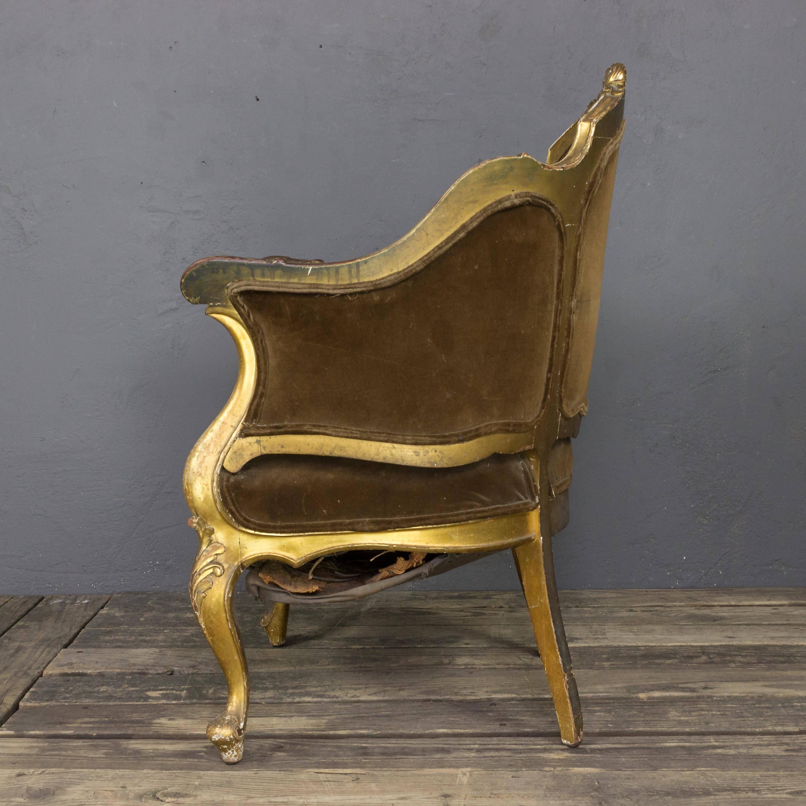 An exquisite French 19th century giltwood armchair. This one-of-a-kind piece is the perfect bridge between new and old school styles, blending notes of classic aesthetics with modern trends. Every curve of the carved wood frame is complemented