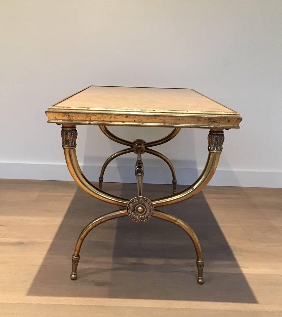 Neoclassical style coffee table with marble top. The base is brass with bronze components. French 1940s, attributed to Raymond Subes. The brass has not been polished in order to maintain its vintage appeal. Polishing is available, price on