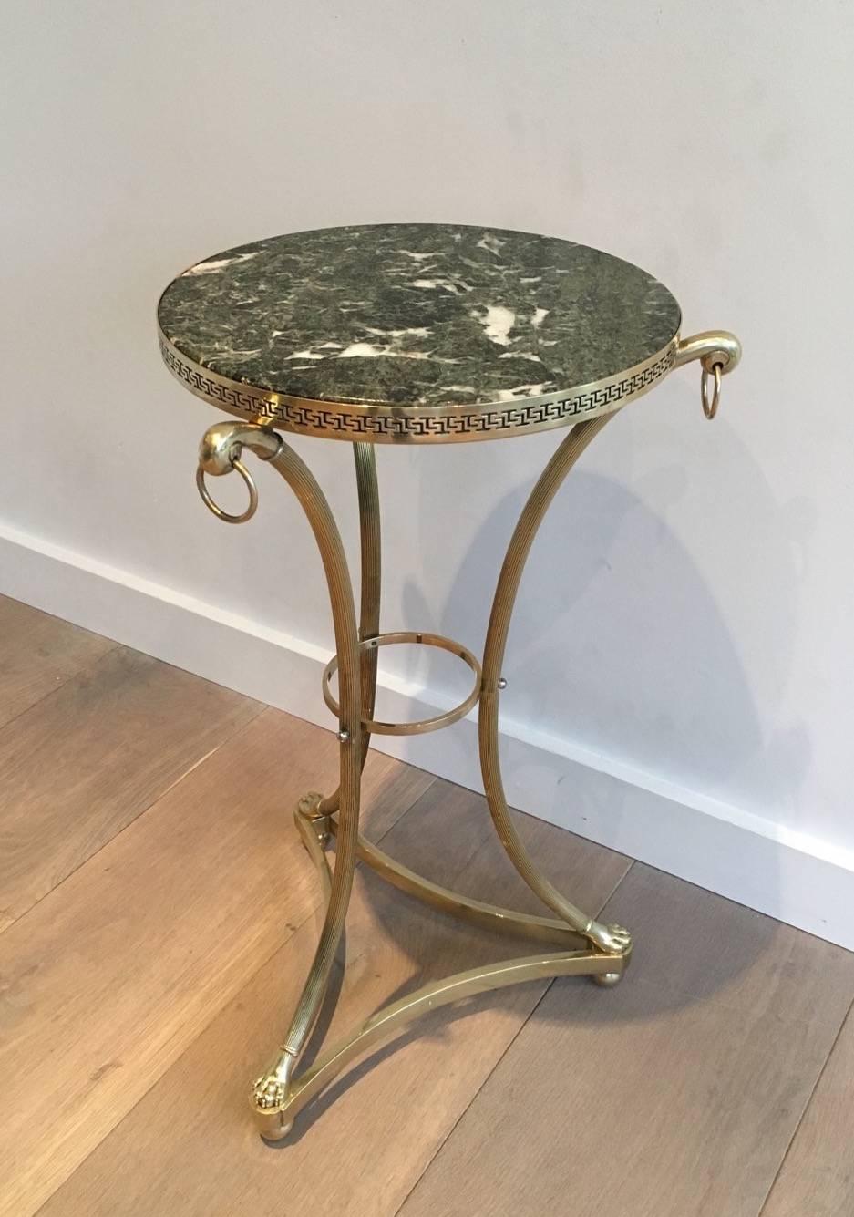 Maison Charles small neoclassical bronze and brass gueridon with green marble top. Clawfeet and Greek key decor.

This table is  currently in France, please allow 2 to 4 weeks delivery to New York. Shipping costs from France to our warehouse in New