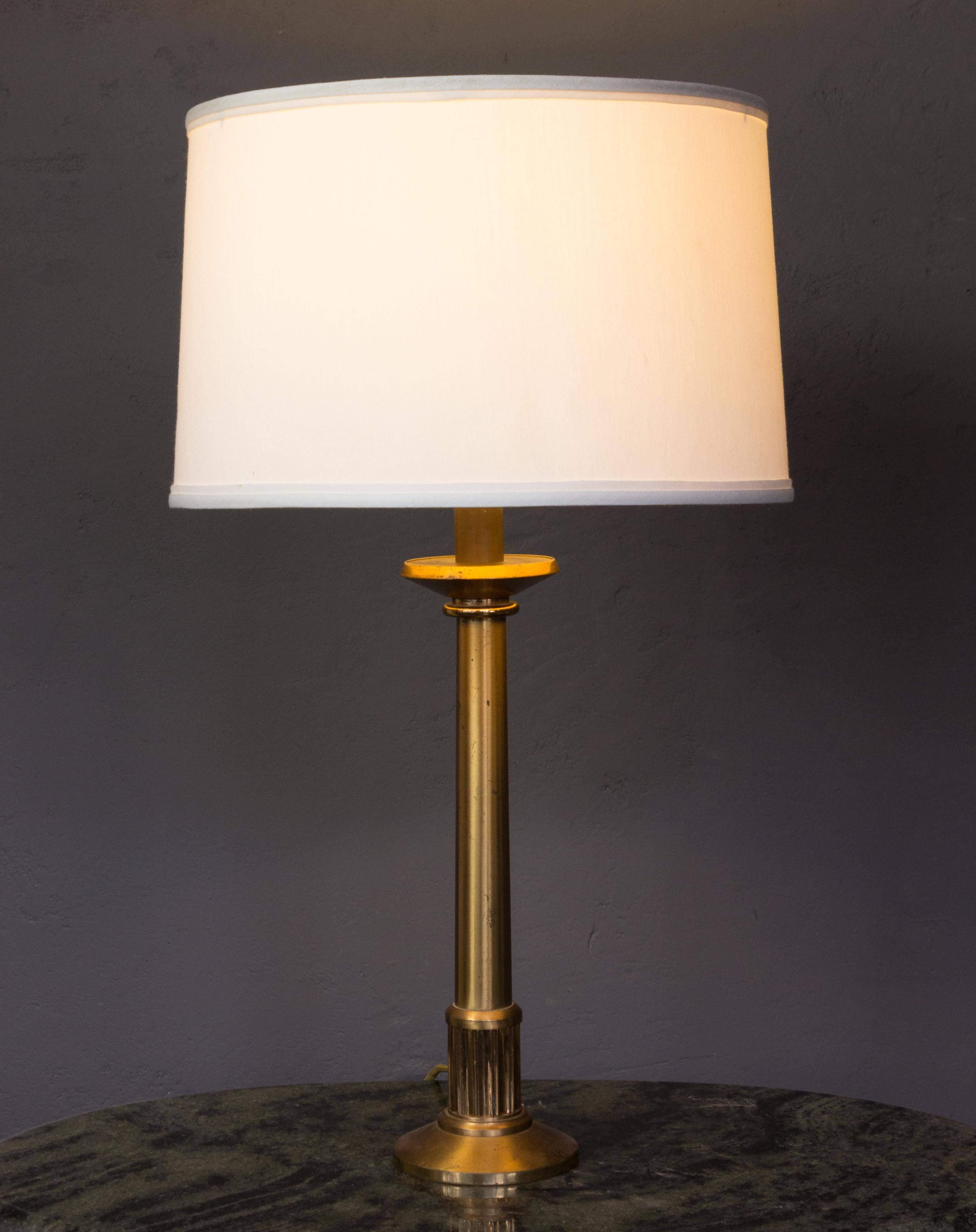 Brass plated bronze table lamps with aged finish and patina. French, ca. 1920s