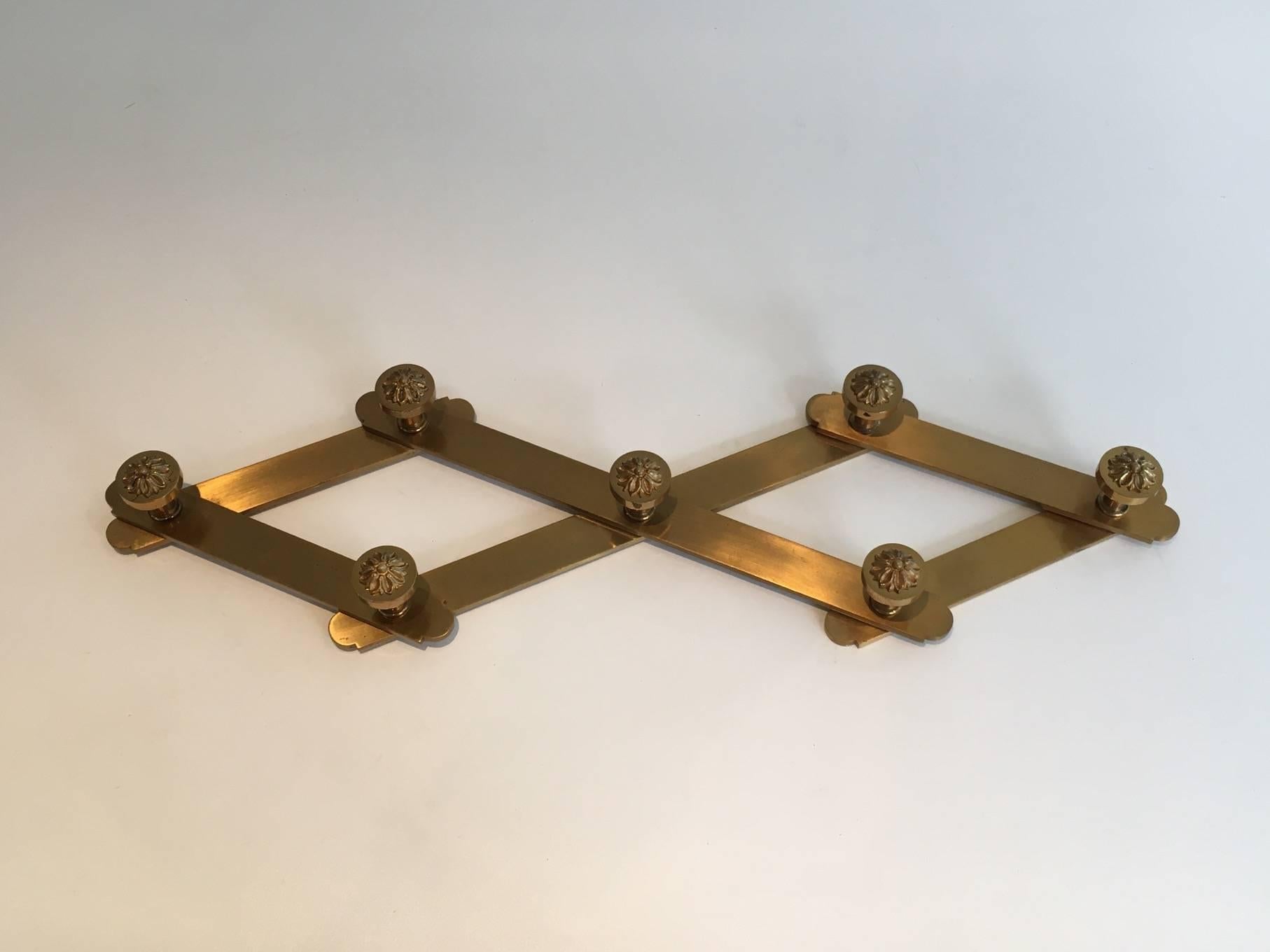 Neoclassical bronze coat hanger with bronze chiselled hooks. In the style of Maison Jansen. French, circa 1960.


This item is currently in France, please allow 2 to 4 weeks delivery to New York. Shipping costs from France to our warehouse in New