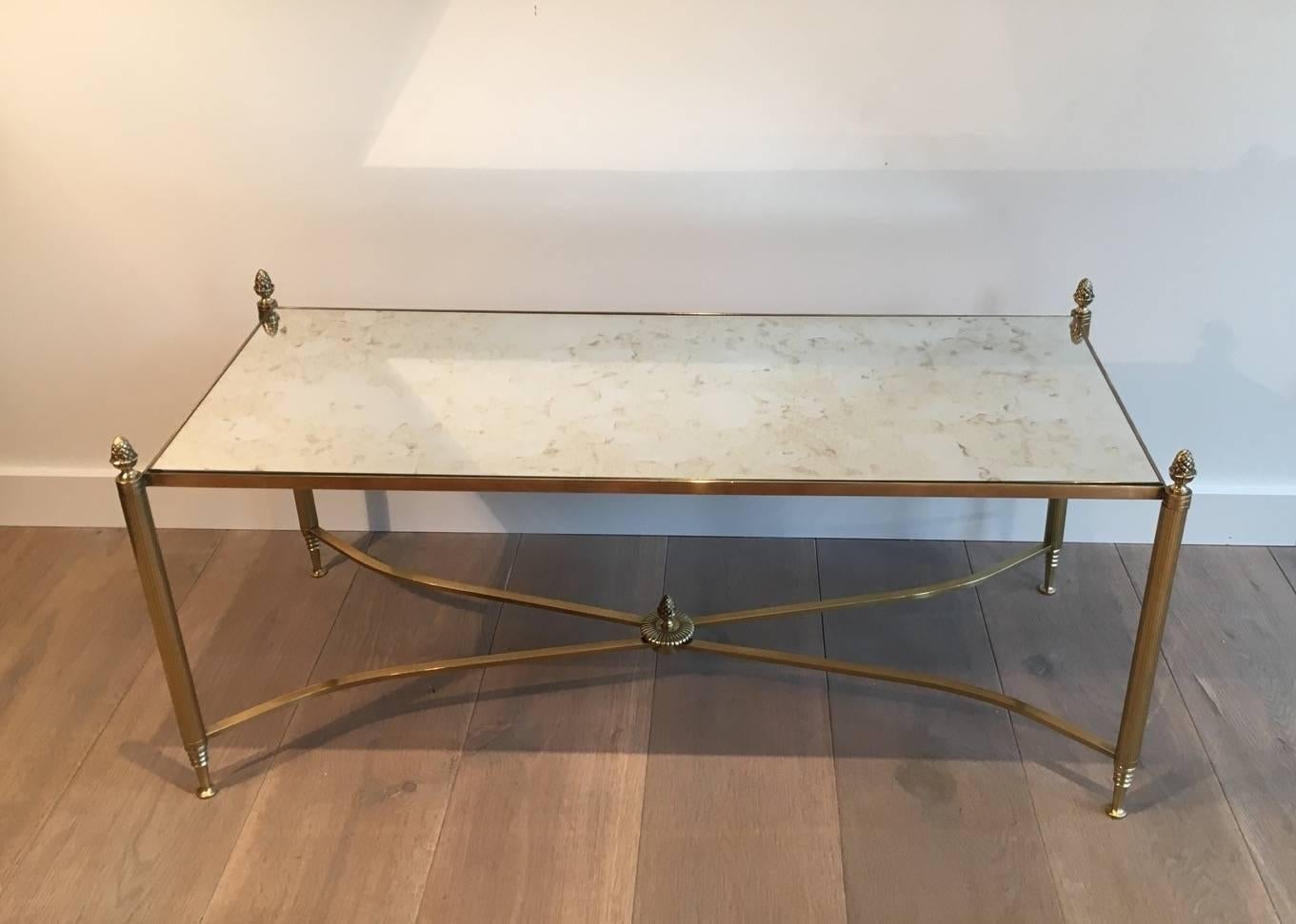 Bronze and brass coffee table with pine cone decorations  attributed to Maison Bagués. French, circa 1940s.

This item is currently in France, please allow 2 to 4 weeks delivery to New York. Shipping costs from France to our warehouse in New York