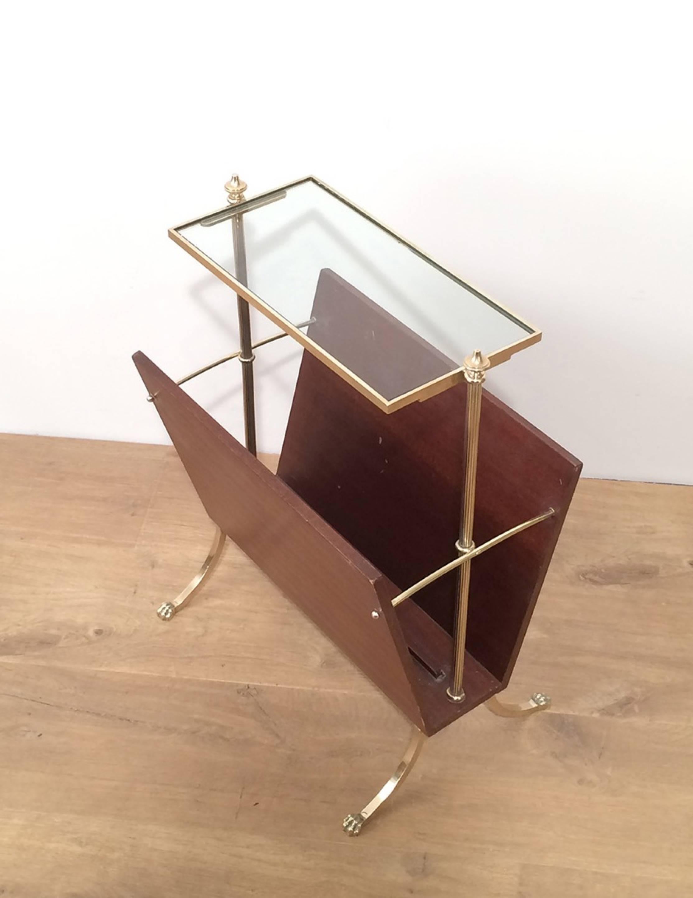 Handsome wood and brass magazine rack with a glass shelf and bronze claw feet. Maison Jansen, circa 1940 

 This piece is currently in France. Please allow us 4 to 6 weeks for delivery. Price includes delivery to our warehouse in Long Island City,