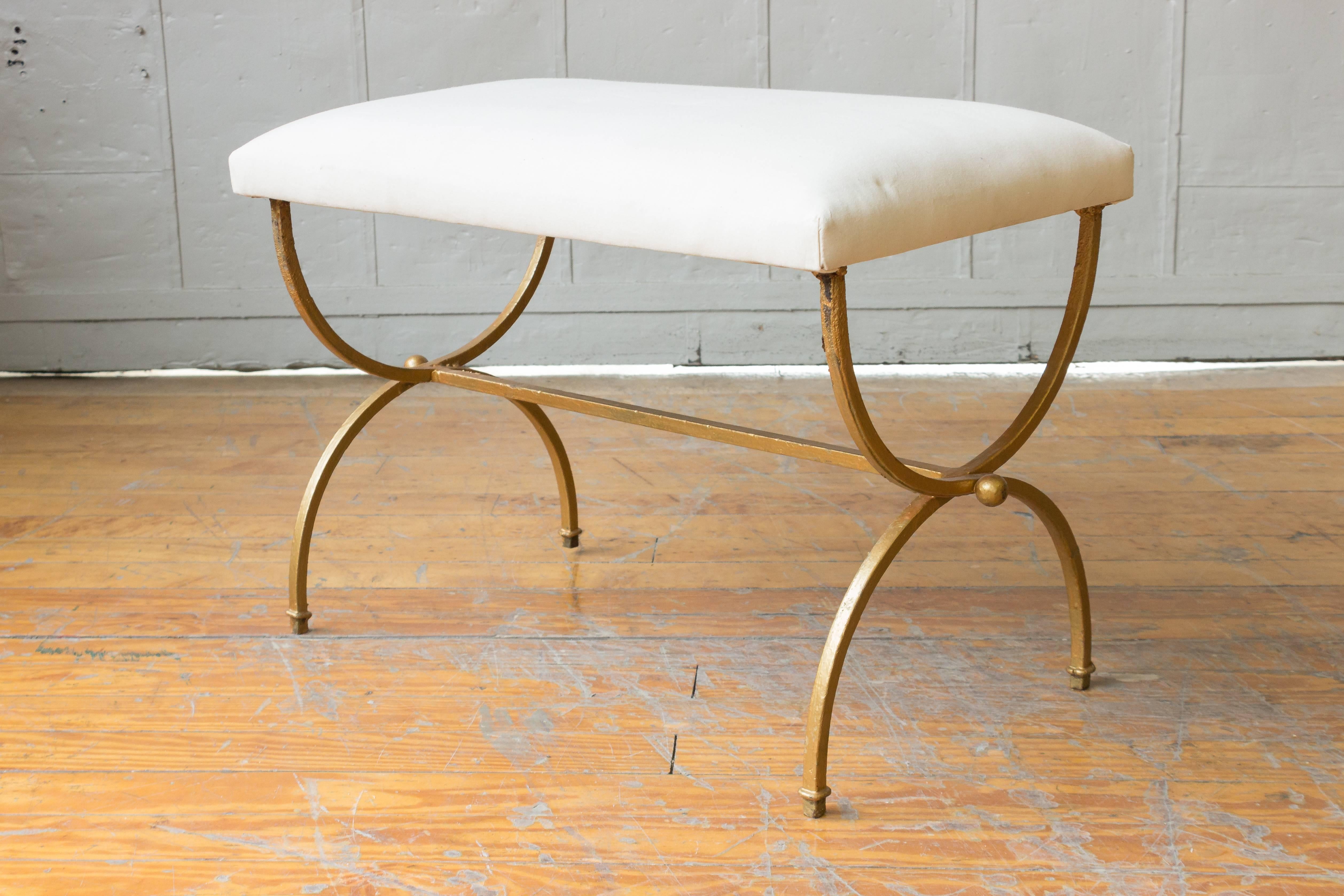 Pair of elegant gilt iron benches upholstered in white muslin. 3 benches are available. Spanish, 1950s.