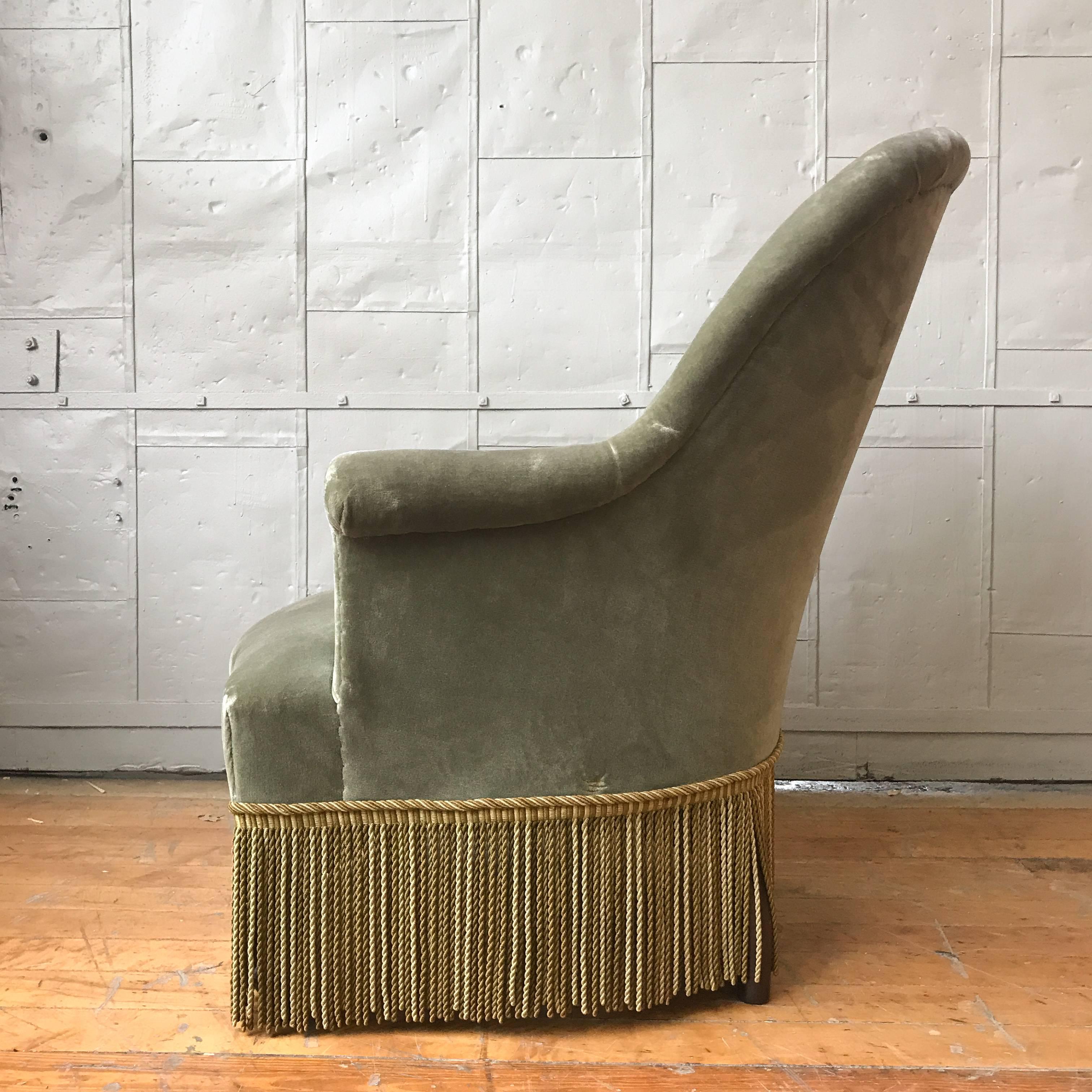 Pair of French Nap III armchairs in sage green velvet with fringe.