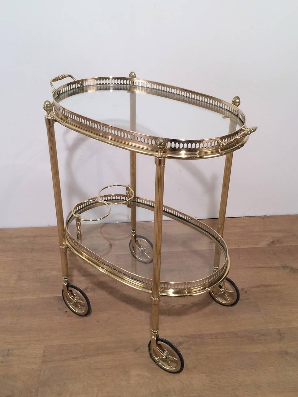 Oval brass bar cart with removable trays.

This piece is currently in France. Please allow us 2 to 4 weeks for delivery. Price includes delivery to our warehouse in Long Island City, NY.